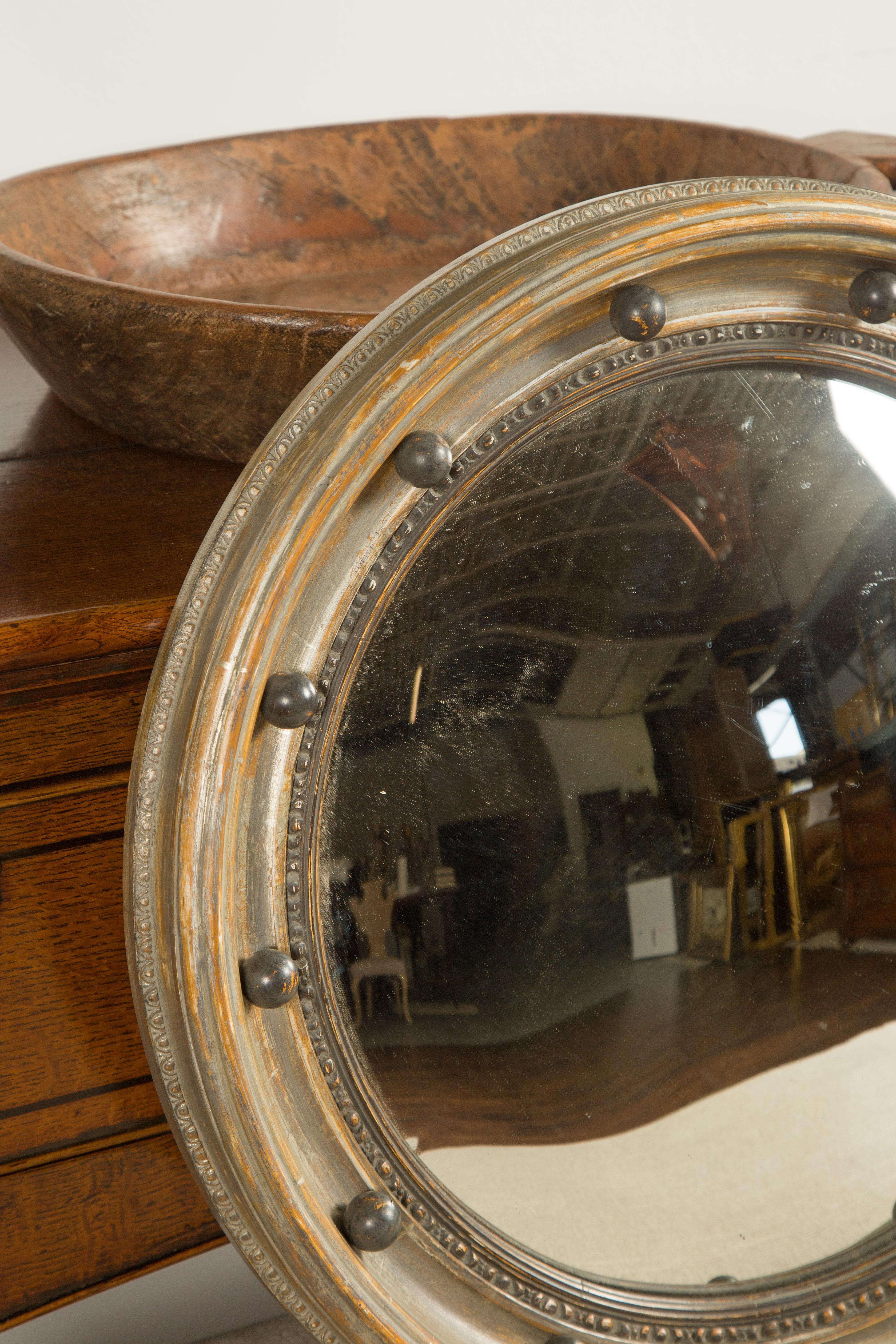 English Midcentury Silver Leaf Carved Convex Bullseye Mirror with Dark Spheres In Good Condition In Atlanta, GA