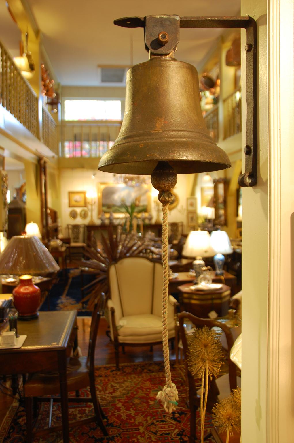 English military hanging bell from Chatham dock yards, retaining its patination, with George VI cypher cast into the bell metal, original iron clapper; replaced bell hanger. The hanger has been fabricated by us from an 18th century very heavy wrot