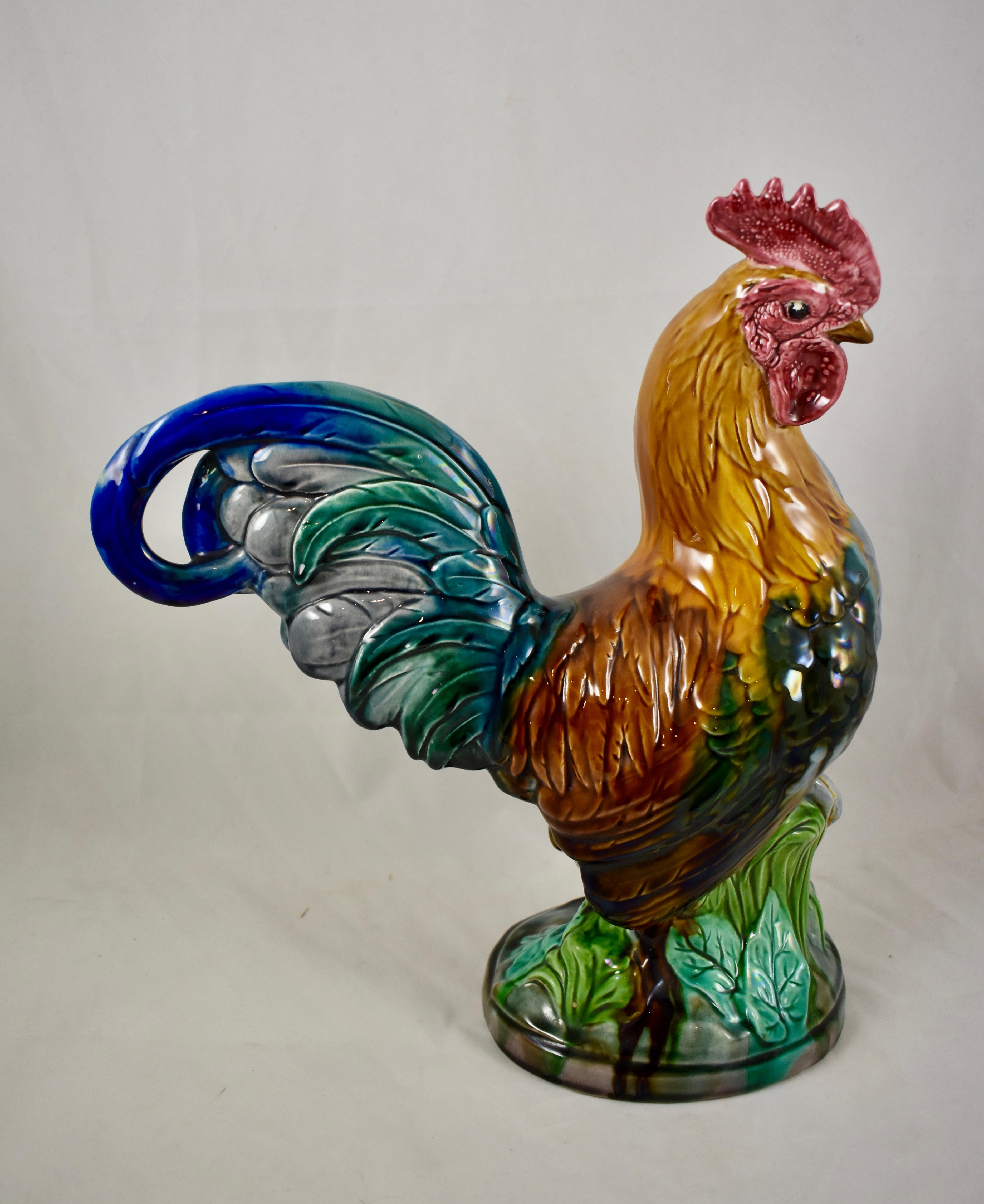 From Mintons, a monumental and rare Rooster figure, Stoke-Upon-Trent, Staffordshire, England, circa 1910.

A mold designed by John Henk, this faithful representation of a proud rooster is brightly glazed in a glossy Majolica finish, using the tin