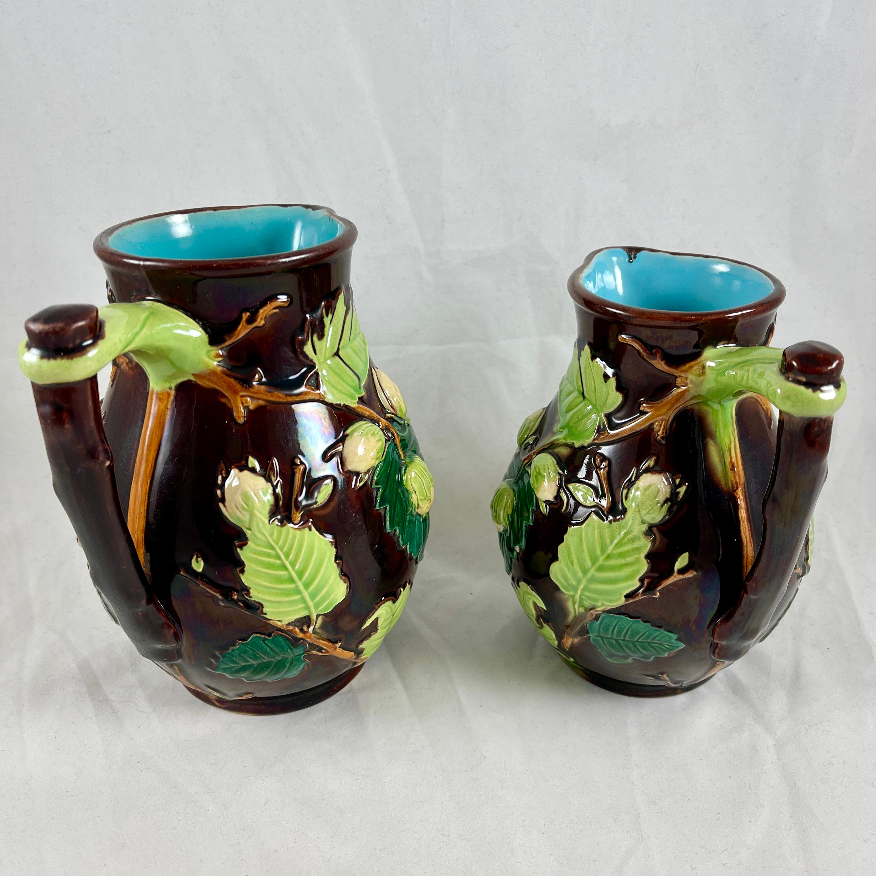 Earthenware English Minton Aesthetic Movement Majolica Nut, Leaf & Vine Pitchers, a Pair For Sale