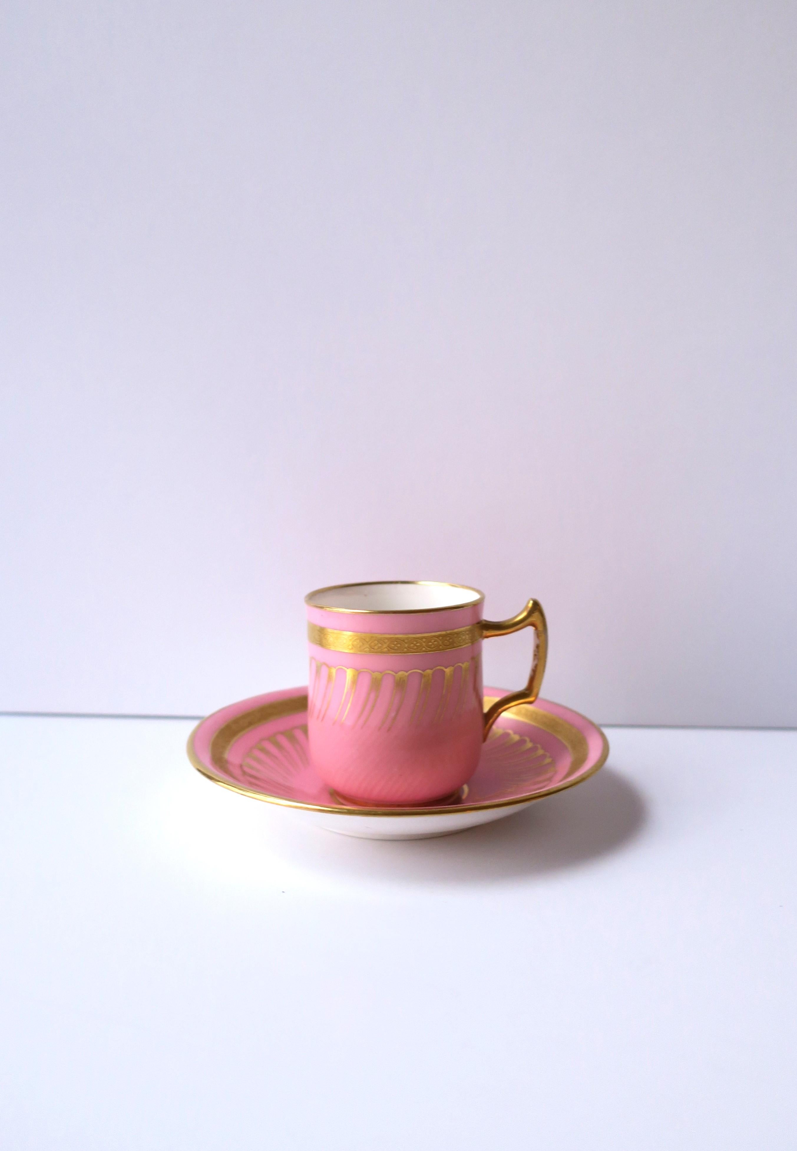 A very beautiful and rare antique English pink and gold porcelain coffee espresso cup and saucer made by Minton expressly for Gilman Collamore & Co., New York, circa late 19th-century, England. The pink and gold hues over white porcelain make a