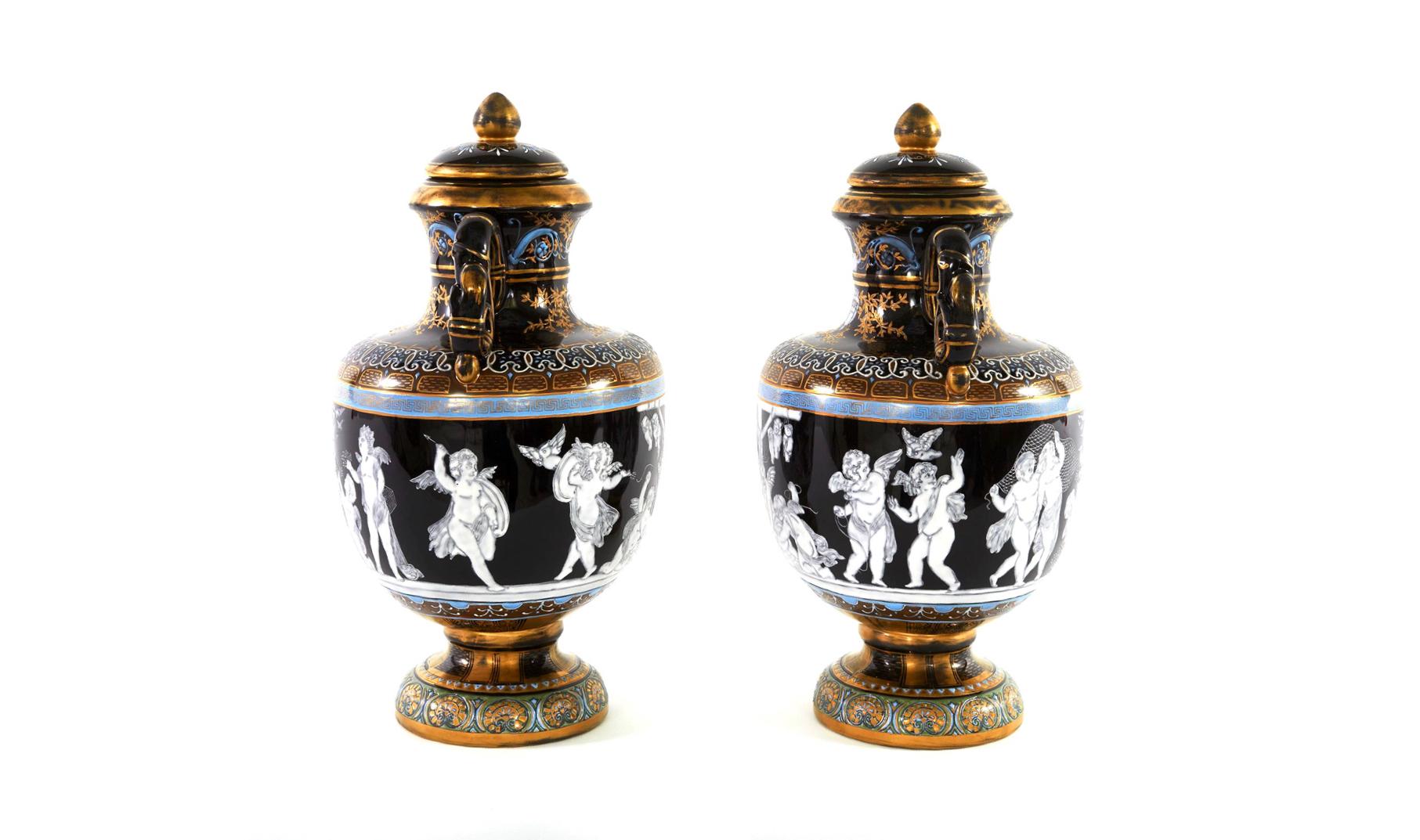 English Minton porcelain pair gilt gold covered decorative urns with exterior design details and two side handles. Each urn is in great condition. Minor wear consistent with age / use. Maker's mark ( crown ). MINTON undersigned. Each one stands