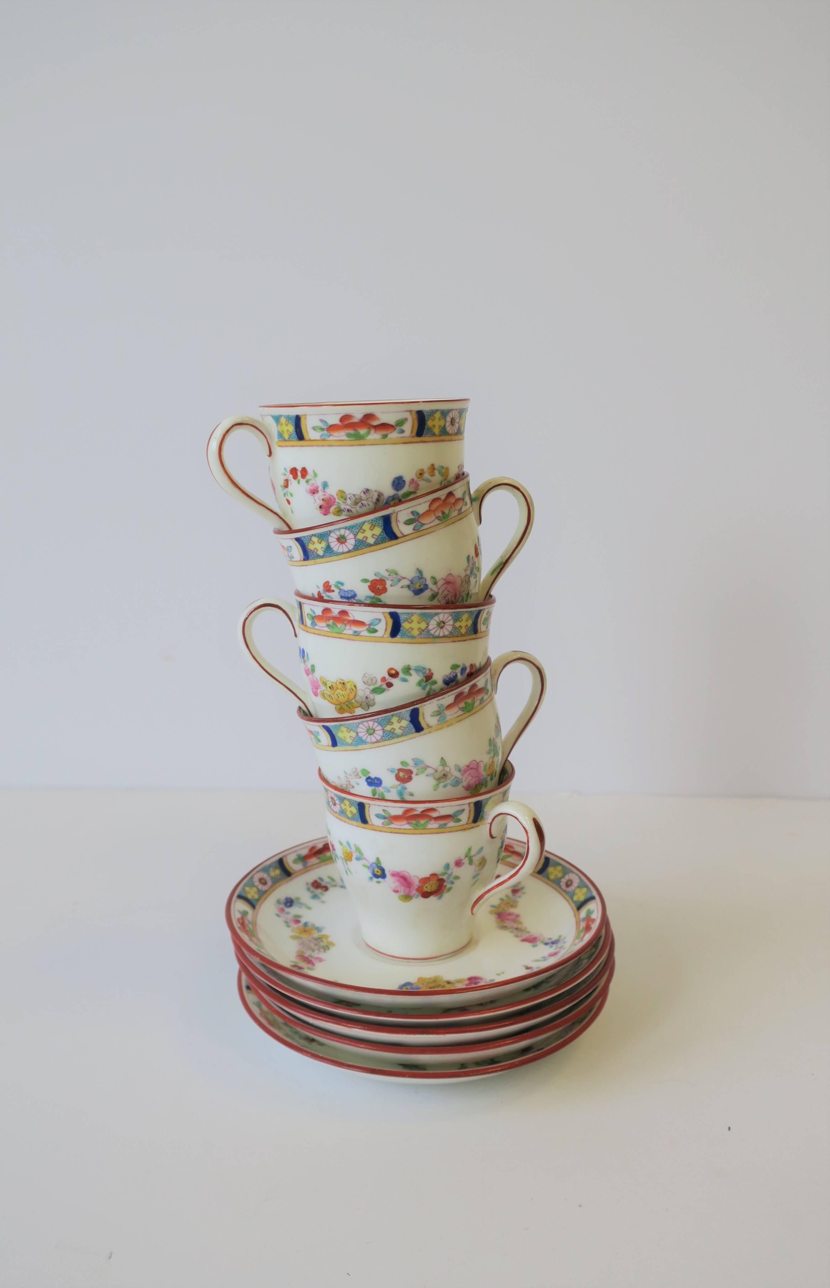 A beautiful set of five English Mintons 'Minton Rose' porcelain espresso coffee or tea demitasse cup and saucer set, circa mid-20th century, England. Beautiful design detail on cups and saucers. Maker's mark's on bottom of all as show in images. Set