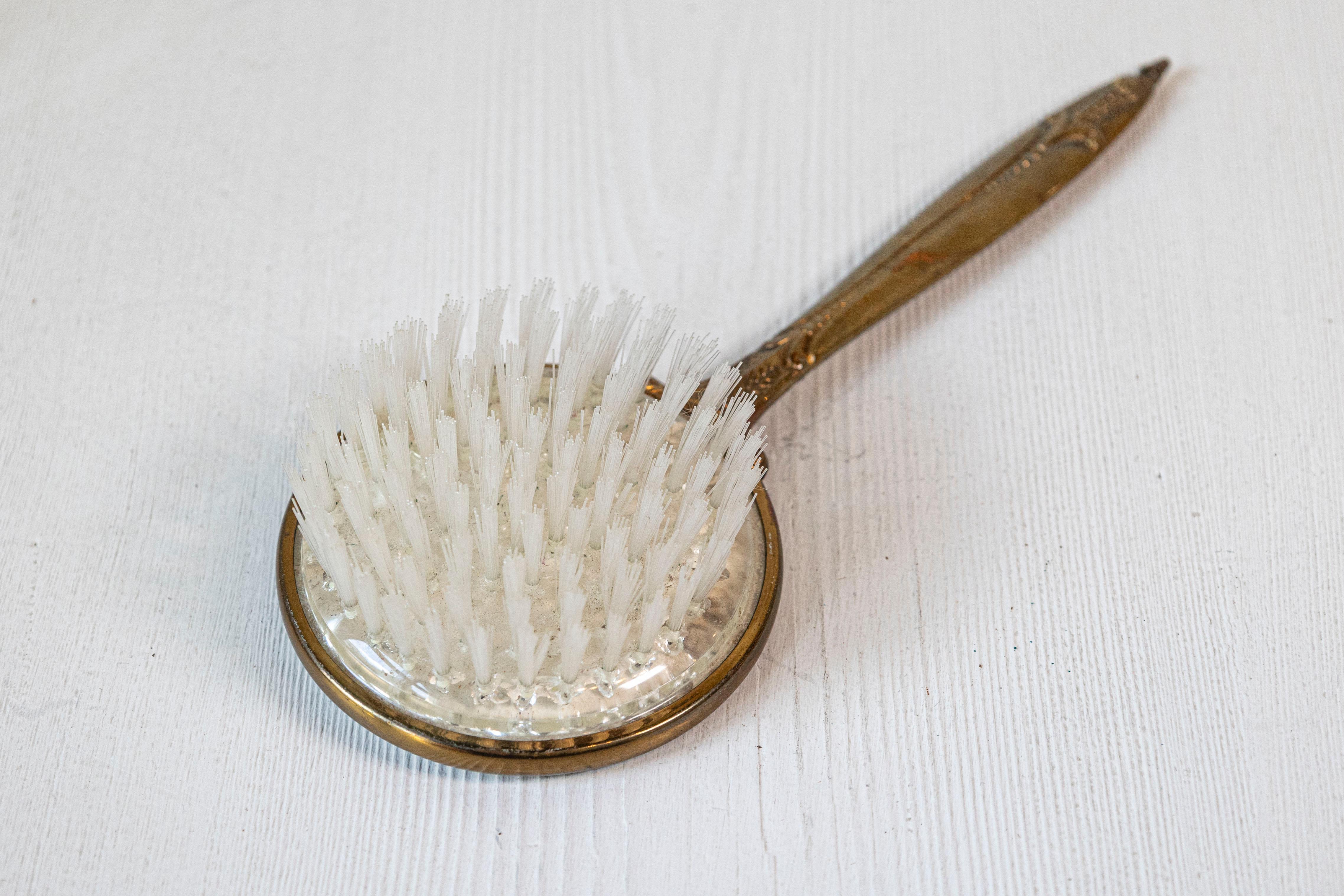 20th Century English Mirrored Hair Brush with Brass Finish, Filigree Décor and Medallion For Sale