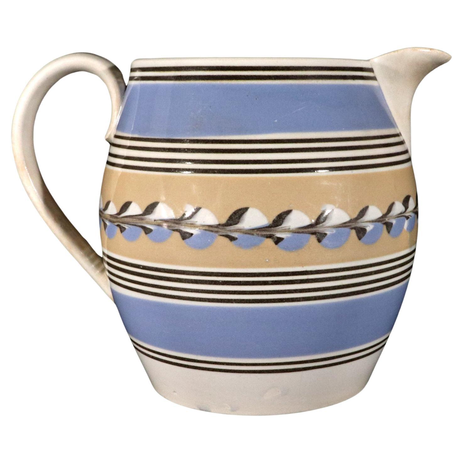 English Mocha Pottery Blue & Yellow Slip Jug with Cat's Eye Decoration For Sale