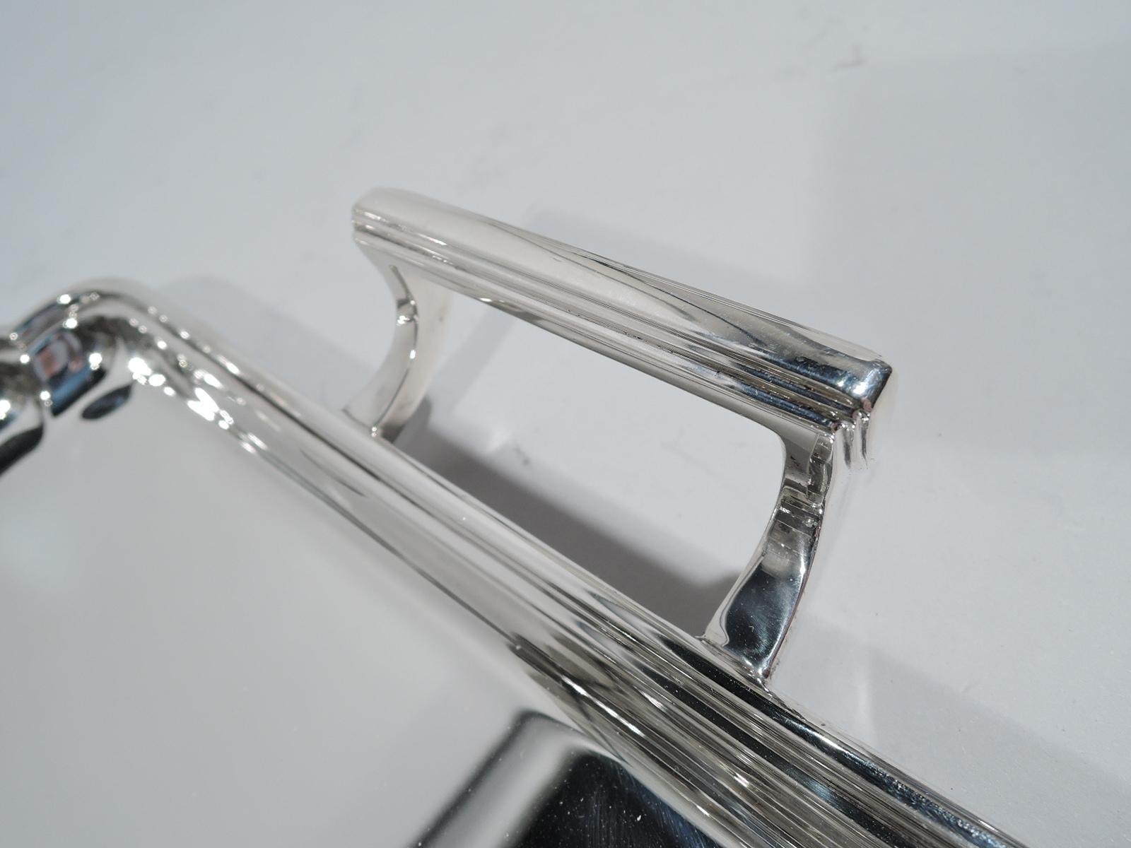 George V sterling silver tray. Made by Frank Cobb in Sheffield in 1937. Rectangular with scalloped corners and scroll-mounted bracket end handles. Molded rim. Stylish Modern Georgian for round-the-clock entertaining from afternoon tea to late-night