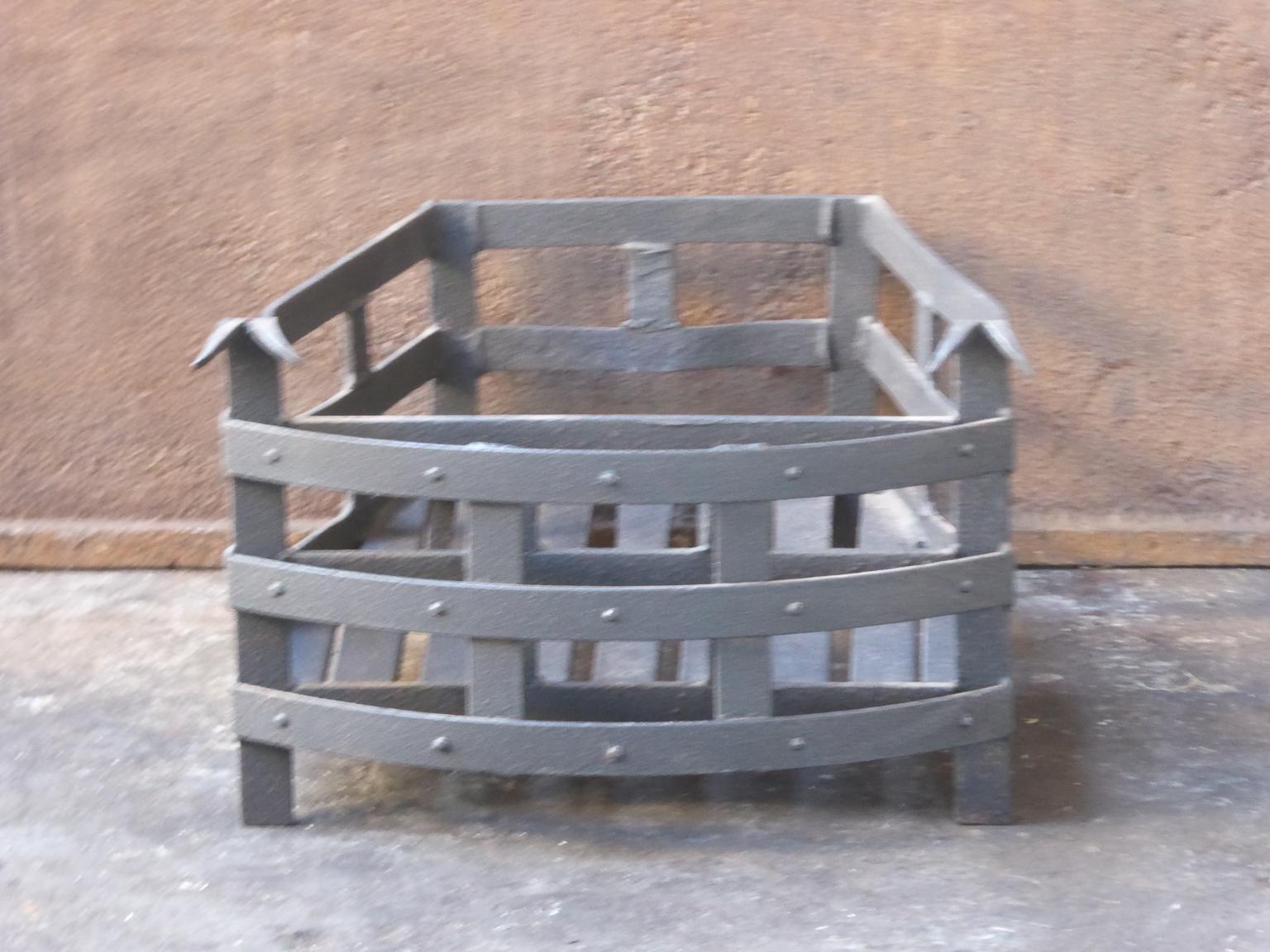English modernist fireplace basket or fire basket. The fireplace grate is made of wrought iron. The total width of the front of the grate is 14.5 inch (37 cm).

















.