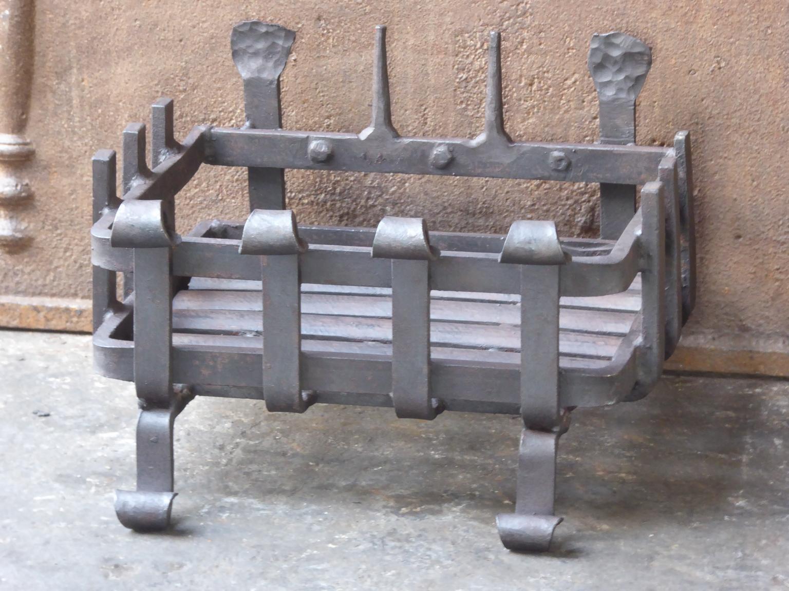 English modernist fireplace basket or fire basket. The fireplace grate is made of wrought iron.

We have a unique and specialized collection of antique and used fireplace accessories consisting of more than 1000 listings at 1stdibs. Amongst others
