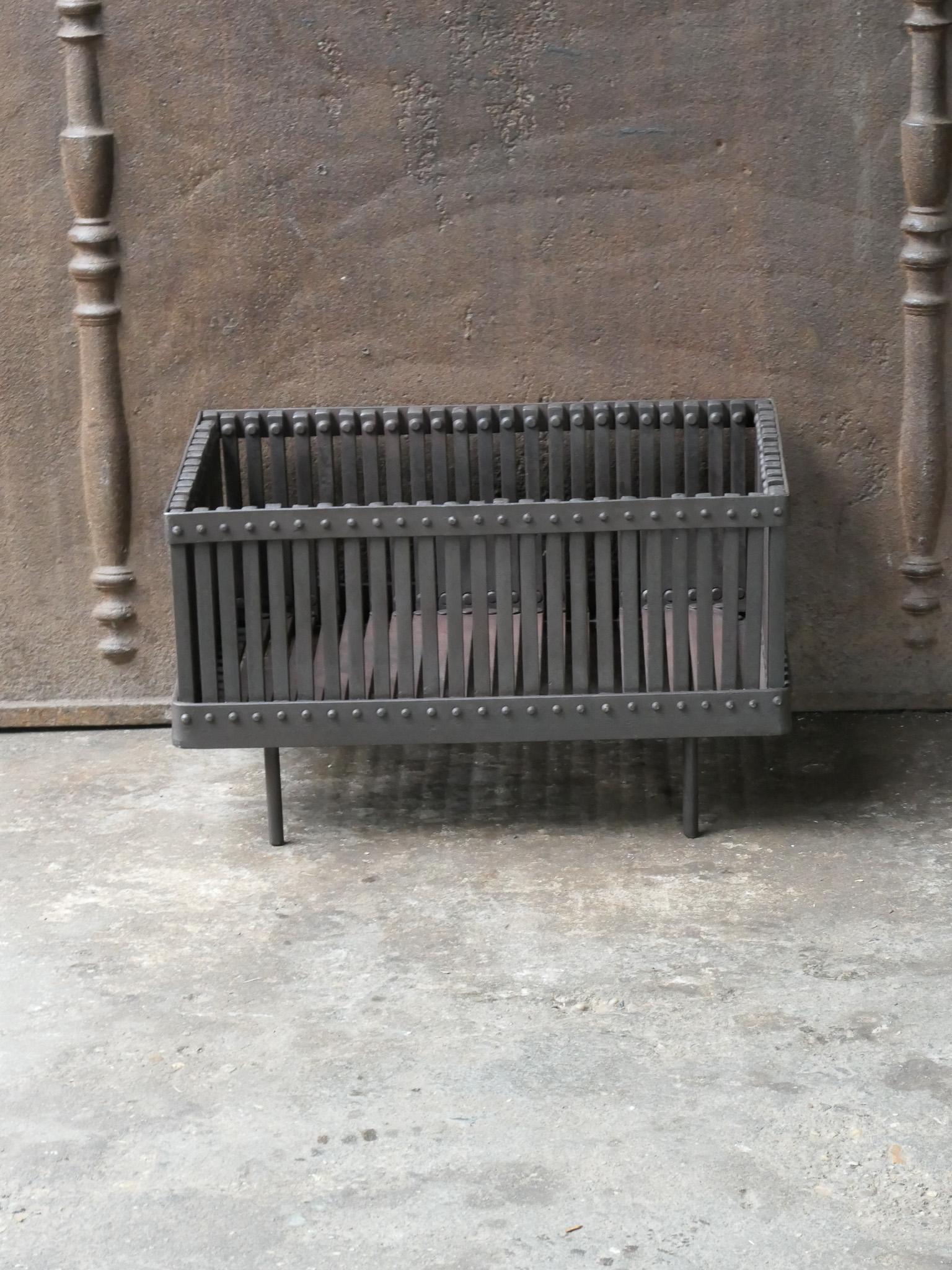 English 20th century modernist fireplace basket or fire basket. The fireplace grate is made of wrought iron.

















   