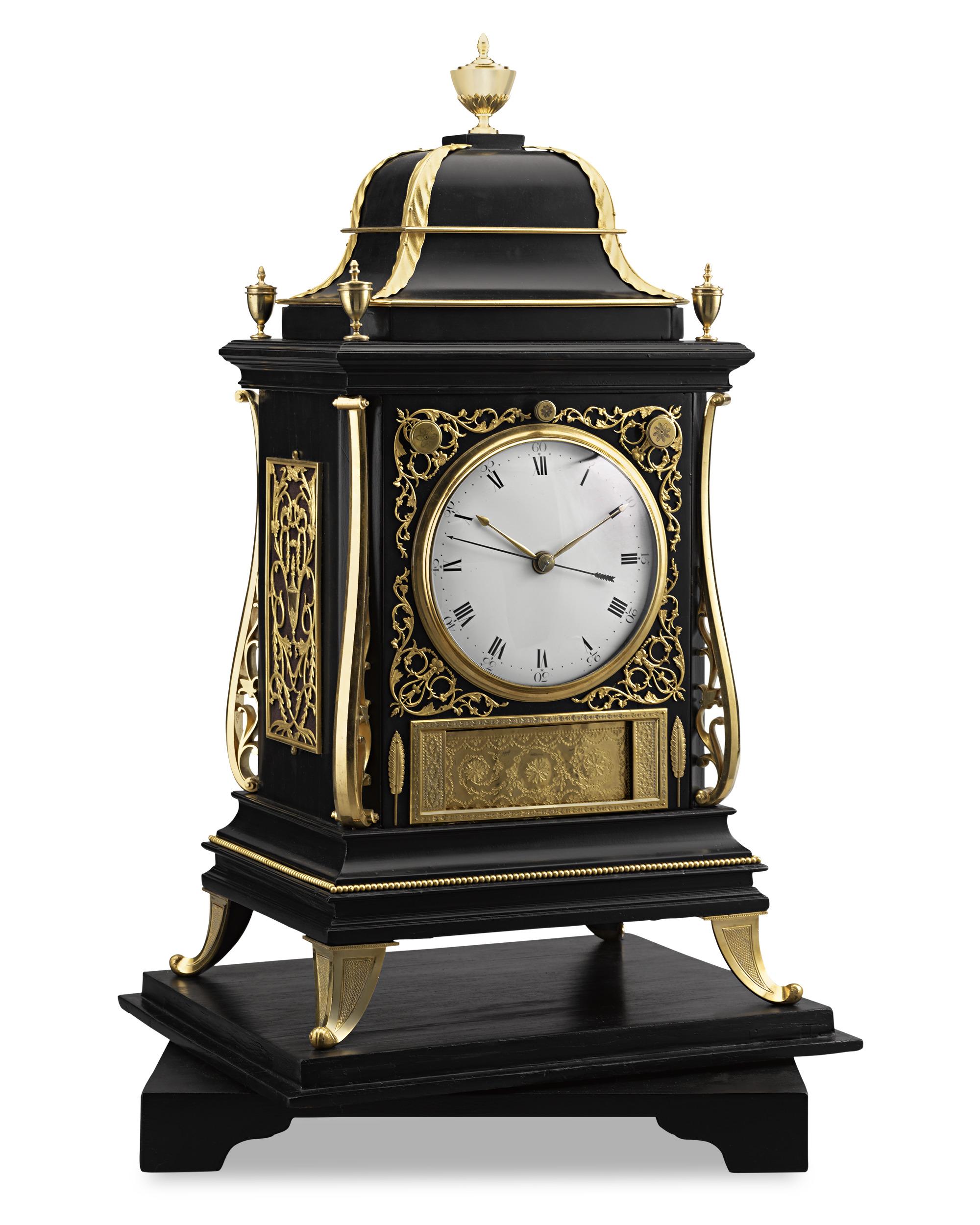 This exceptional three-train chain fusee musical diorama clock is a horological, mechanical and artistic masterpiece. When melodic bells strike the hour, a brass curtain below the dial opens, and music plays to reveal a detailed diorama of ships
