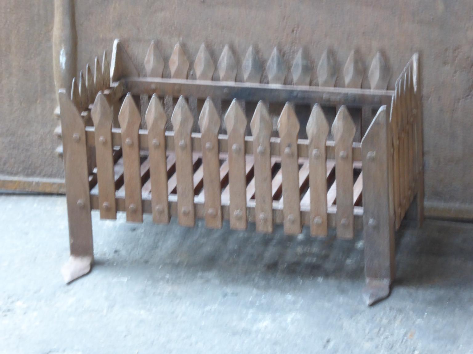 20th century English neo Gothic fireplace style basket or fire basket. The fireplace grate is made of wrought iron and cast iron. It has a natural brown patina.

















 