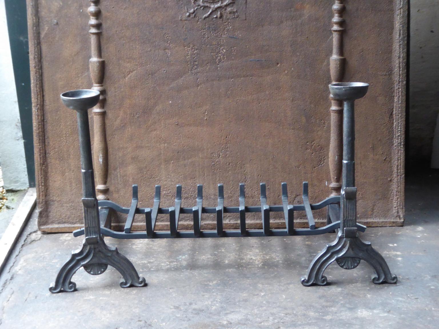 English neo gothic fireplace style basket or fire basket. The fireplace grate is made of cast iron and wrought iron. The total width of the front of the fireplace grate is 37.4 inch (95 cm).

















