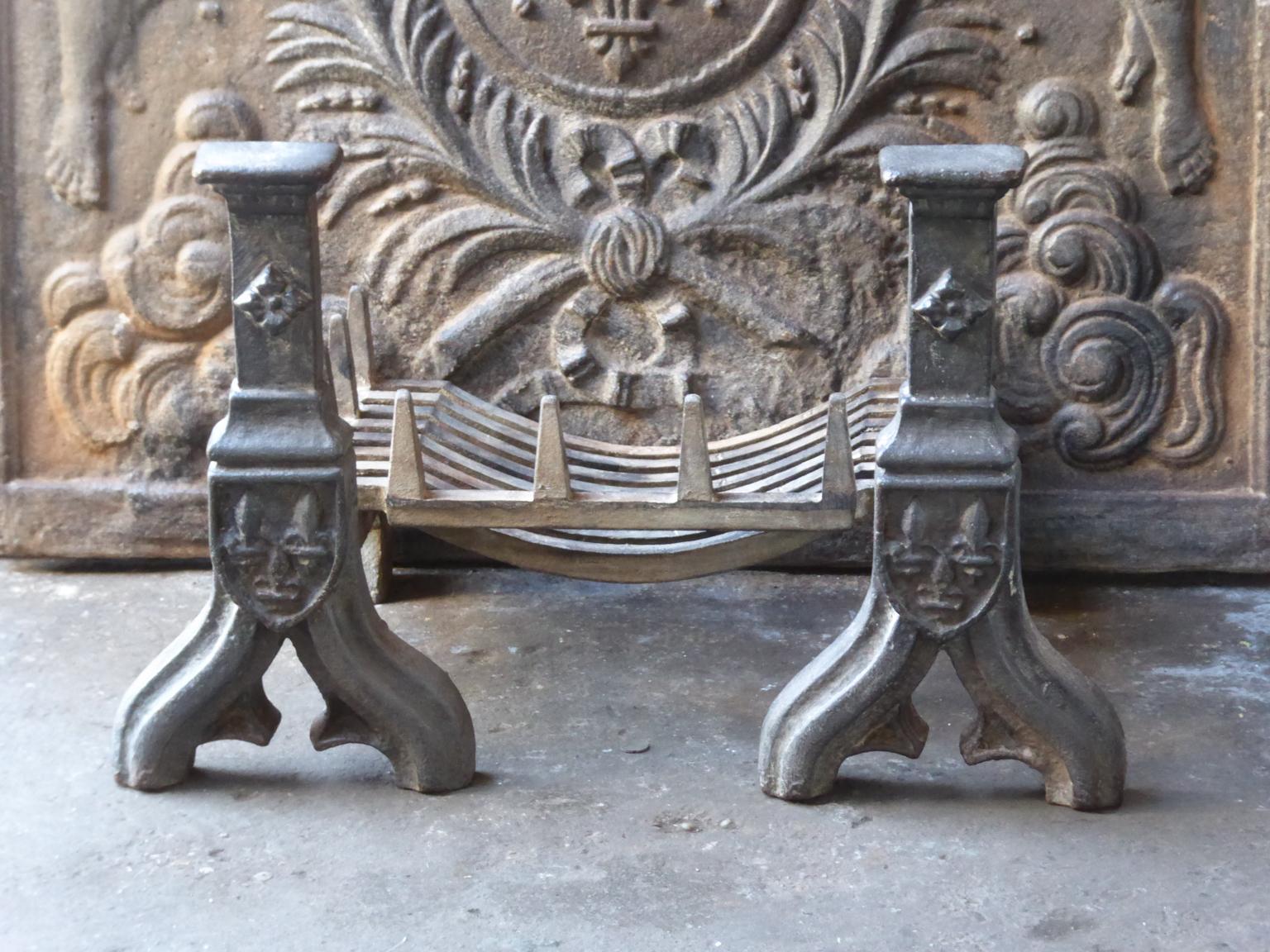 English neo gothic fireplace style basket or fire basket. The fireplace grate is made of cast iron. The total width of the front of the fireplace grate is 27 inch (69 cm).

















 