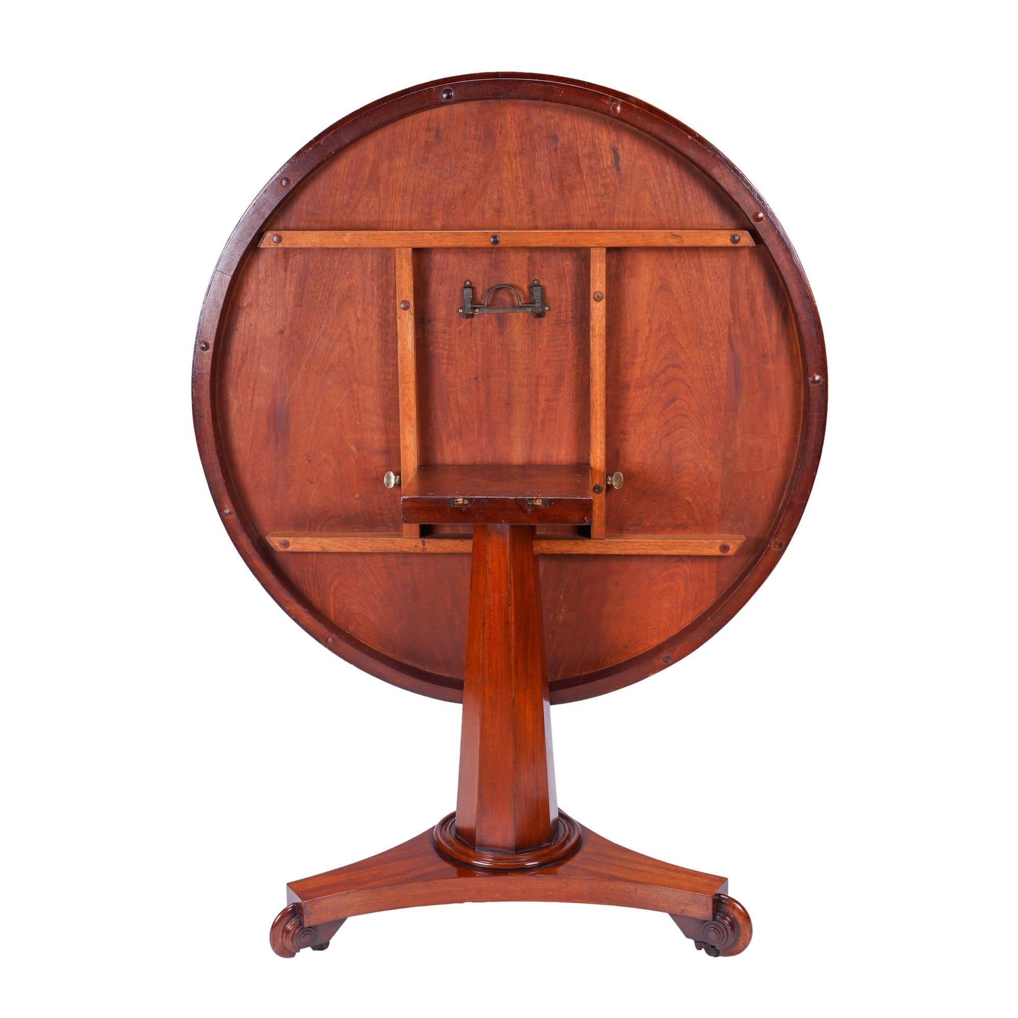 Brass English Neoclassic mahogany circular tilt top pedestal table, c. 1830 For Sale