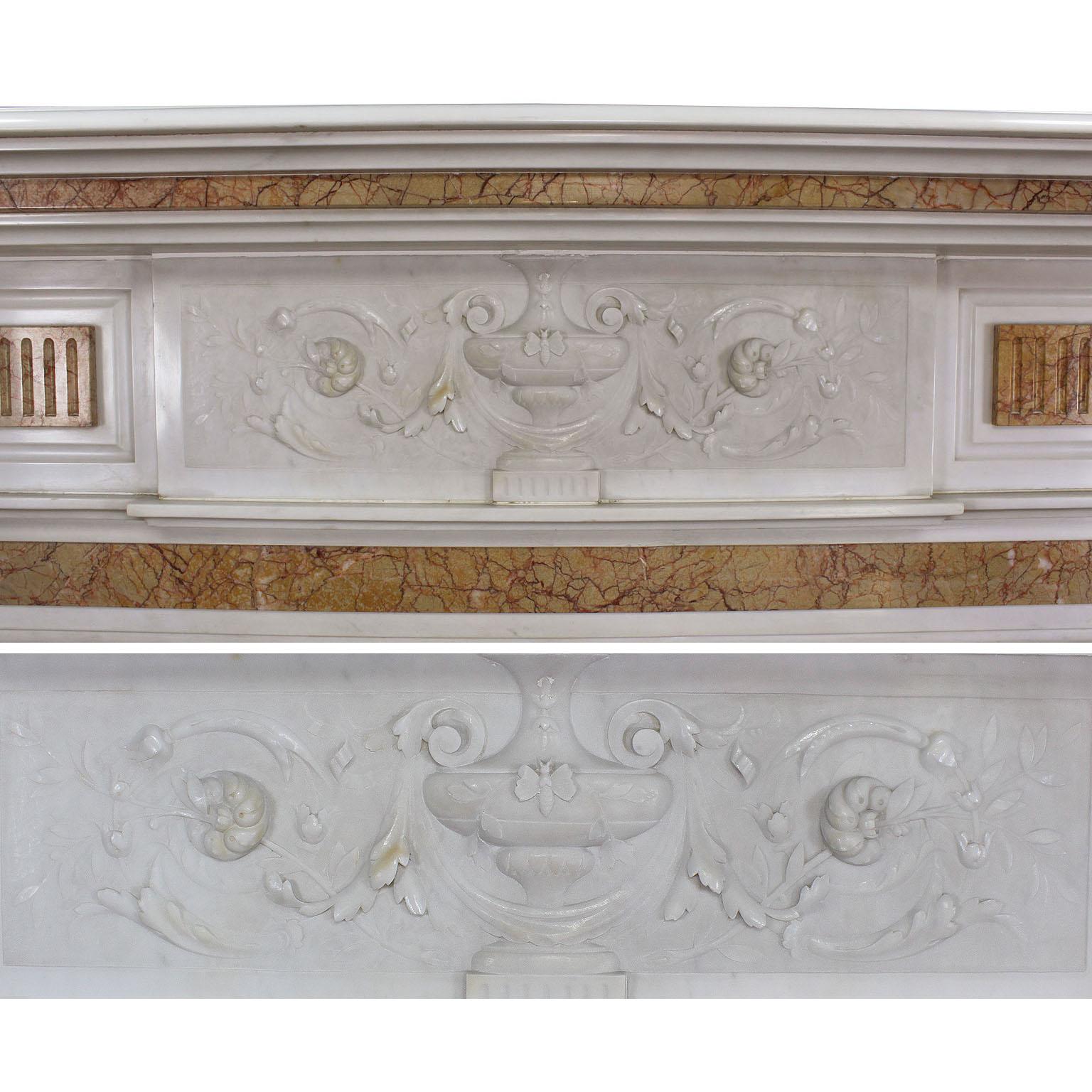 A fine English neo-classical and Georgian style carved statuary and Spanish brocatelle marble fireplace mantel, surmounted by a pair of columns, urn carvings and centred with a detailed carved marble vase with a bumble-bee, swags, scrolls and
