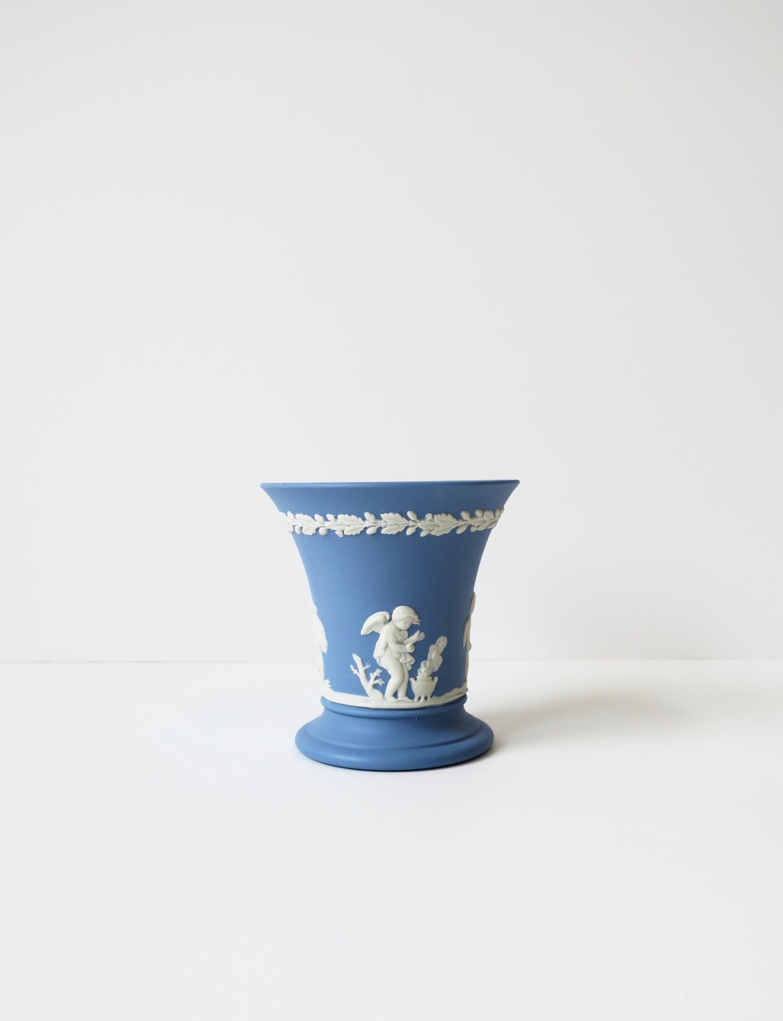 A beautiful blue and white English Wedgwood Jasperware matte stoneware vase in the Neoclassical style, England, 1967. 
All authentication markings' on bottom including; 