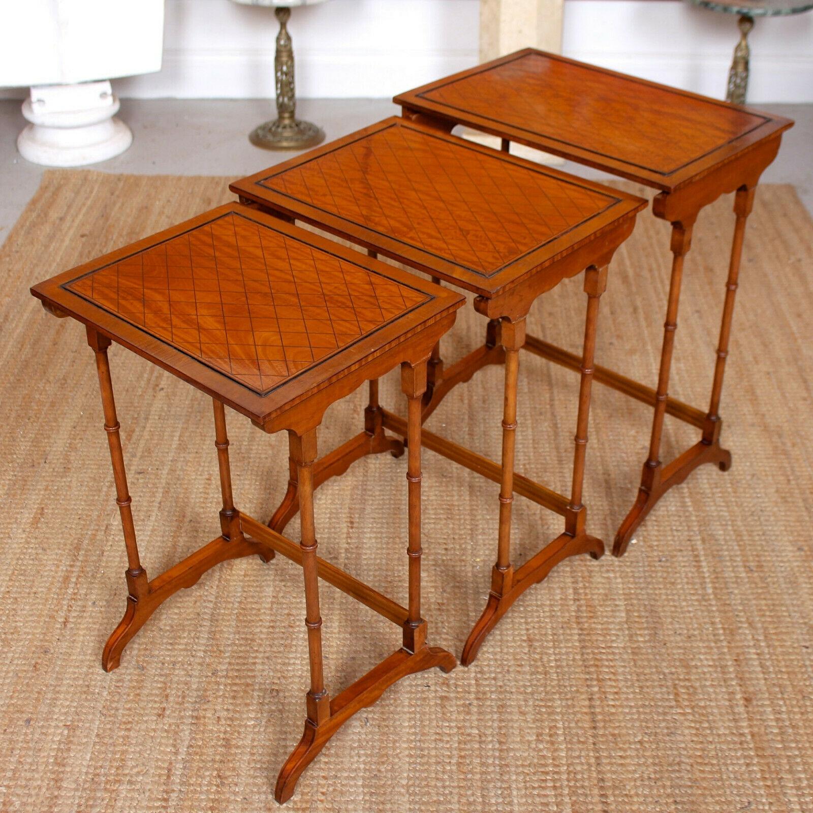 An impressive fine quality nest of three tables in the Georgian manner.
The cross-banded trellis tops raised on slender turned legs and carved feet united by stretchers.