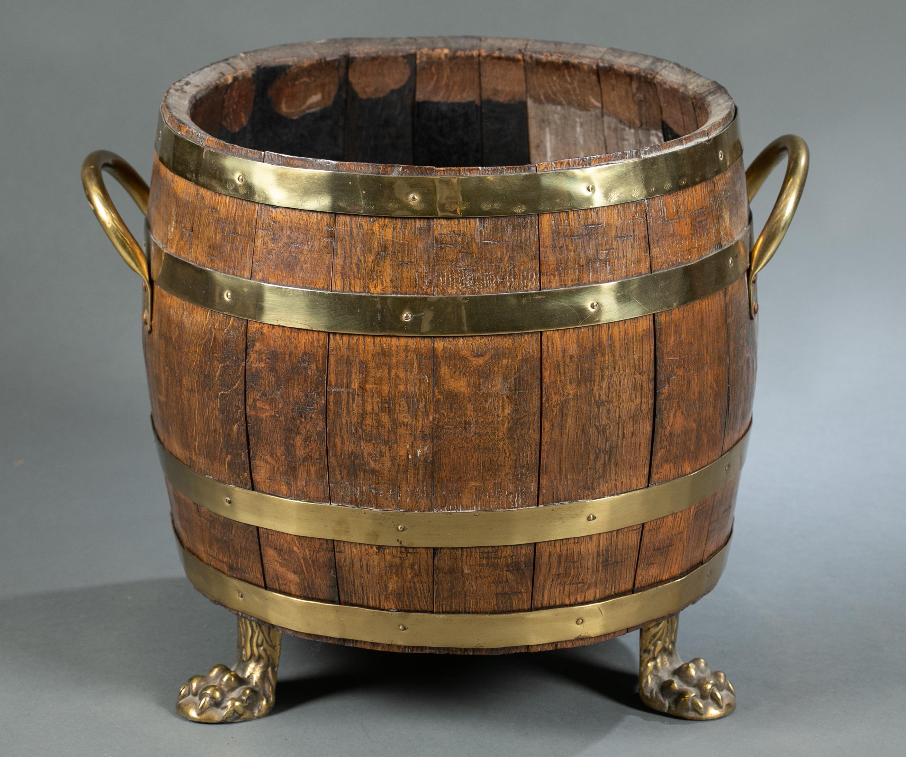 English Oak and Brass Barrel Shaped Cellarette with Paw Feet In Good Condition In Middleburg, VA