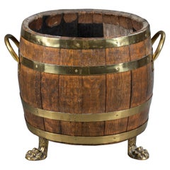 English Oak and Brass Barrel Shaped Cellarette with Paw Feet