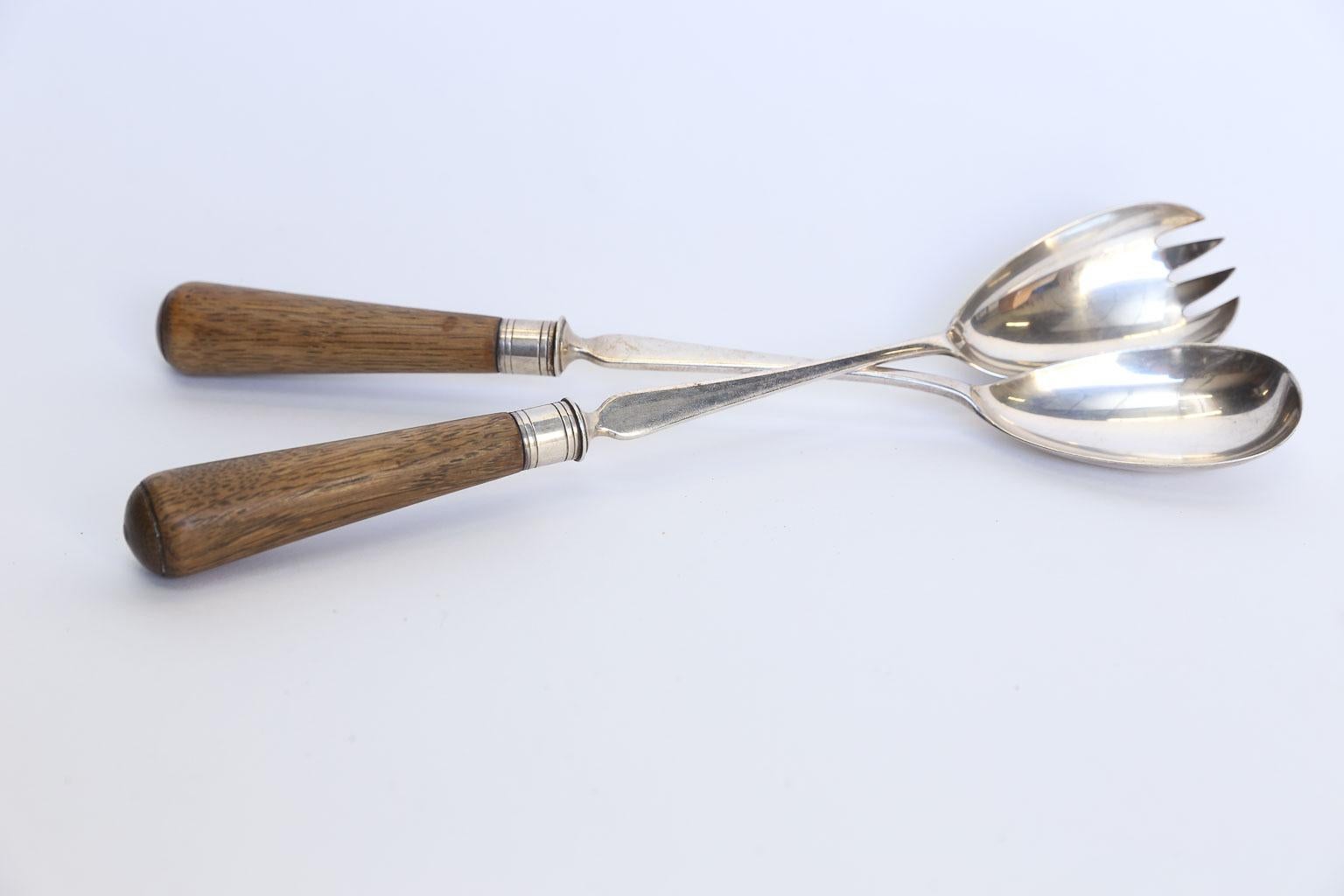Lovely pair of English salad servers made in traditional oak and silver plate. These will surely add vintage English charm to your table. Measurements below are for each individual piece.