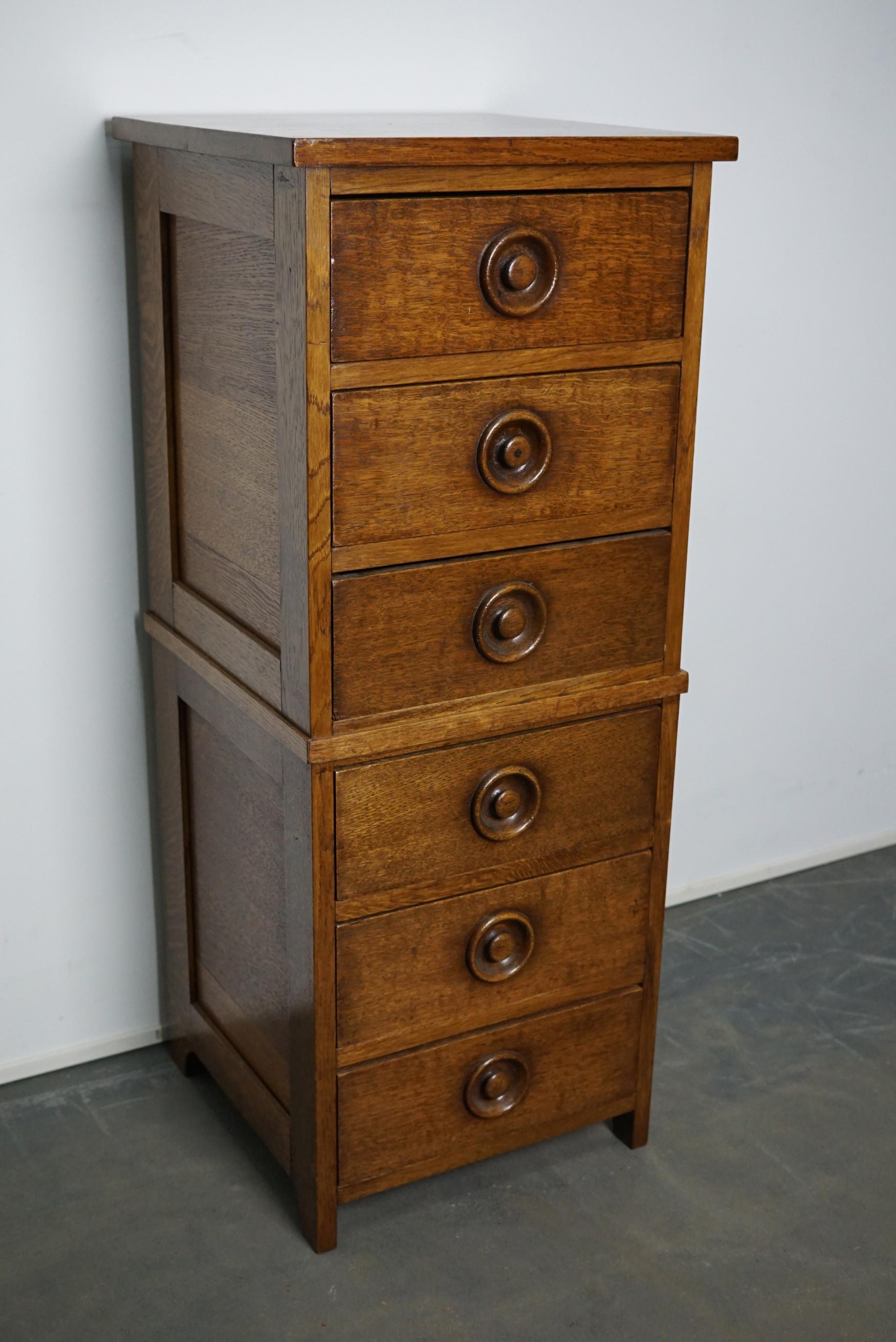 This apothecary cabinet was made circa 1930s in England. It features 6 drawers with nice handles. It is made from oak and it remains in a very good condition. The interior dimensions of the drawers are: D 36 x W 32.5 x H 12 cm.
  