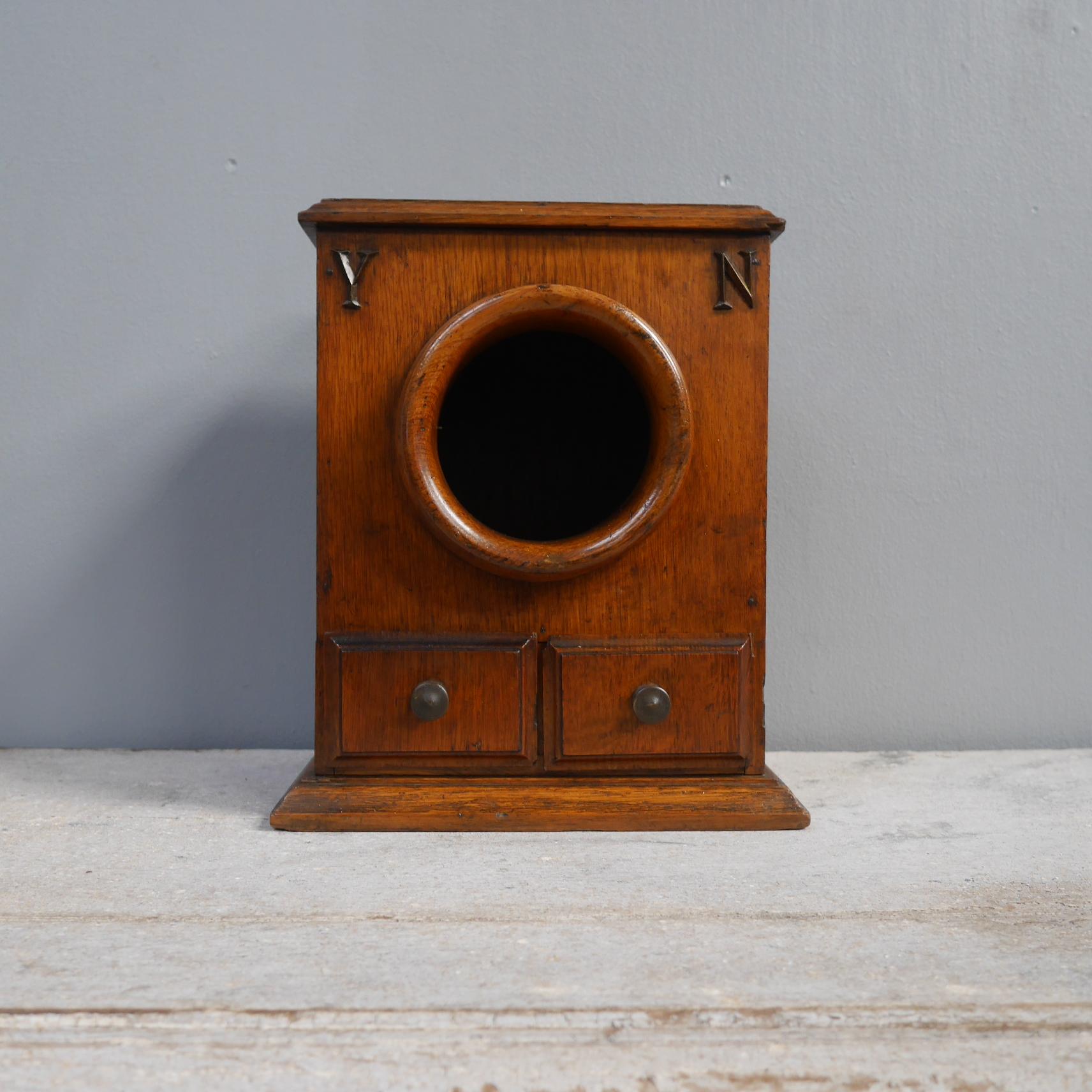 A scarce oak ballot box by Toye & Co.
Of the absolute highest quality, in solid oak throughout with two lined drawers below the shrouded aperture above, finished with cast bronze Y & N (Yes & No) letters & an inlaid makers plaque to the lower back