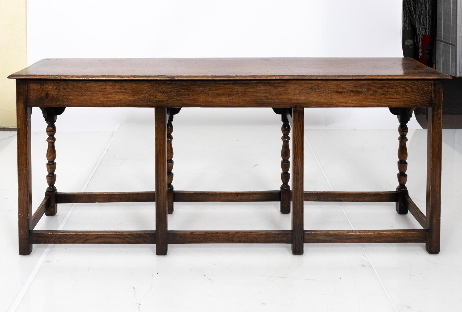 English oakwood console table with turned Barley twist legs, curved skirt, and box stretcher. The piece is also stamped 