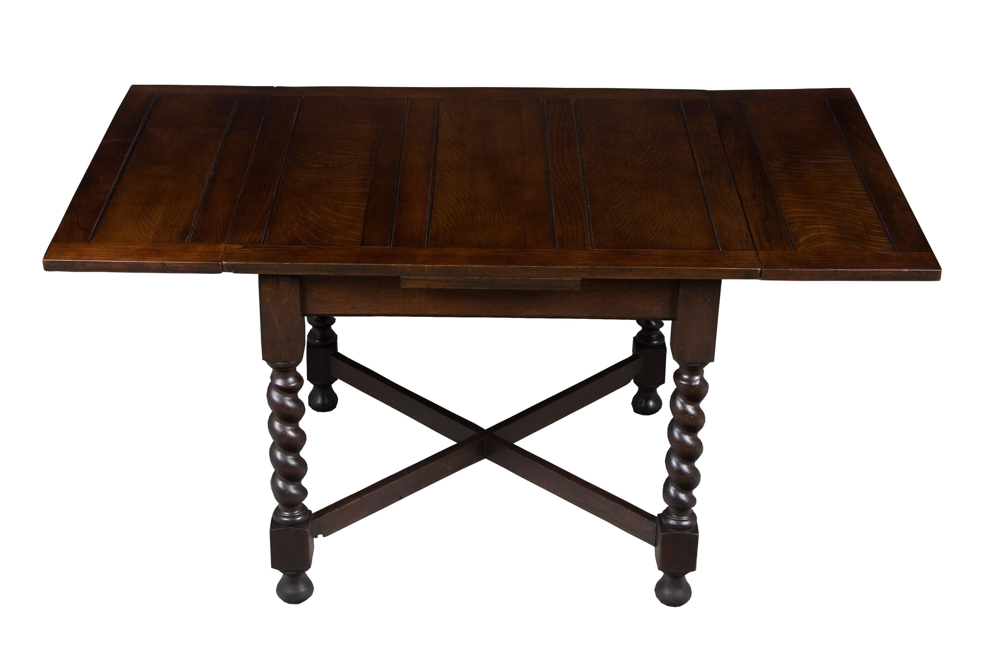 This exquisite dark oak pub table was crafted in England, circa 1920. Over the years, the rich oak has developed a lovely patina, which has helped flesh out the natural beauty of the wood. As a result, the oak displays a distinguished complexion and