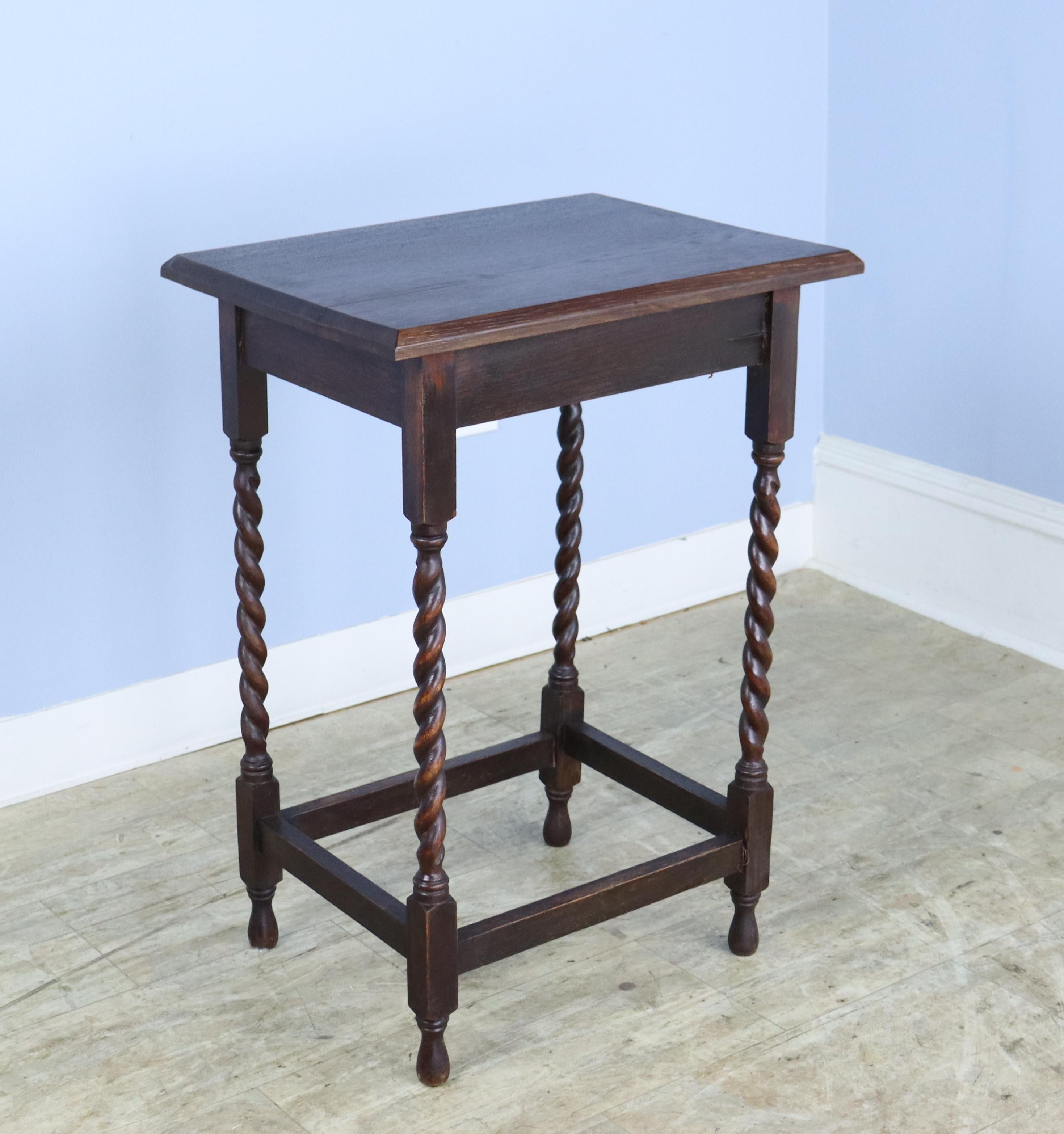 A charming simple occasional table in dark oak with eye-catching barley twist detail. Would also make a nice lamp table, and would look well on either side of a sofa or guest bed.