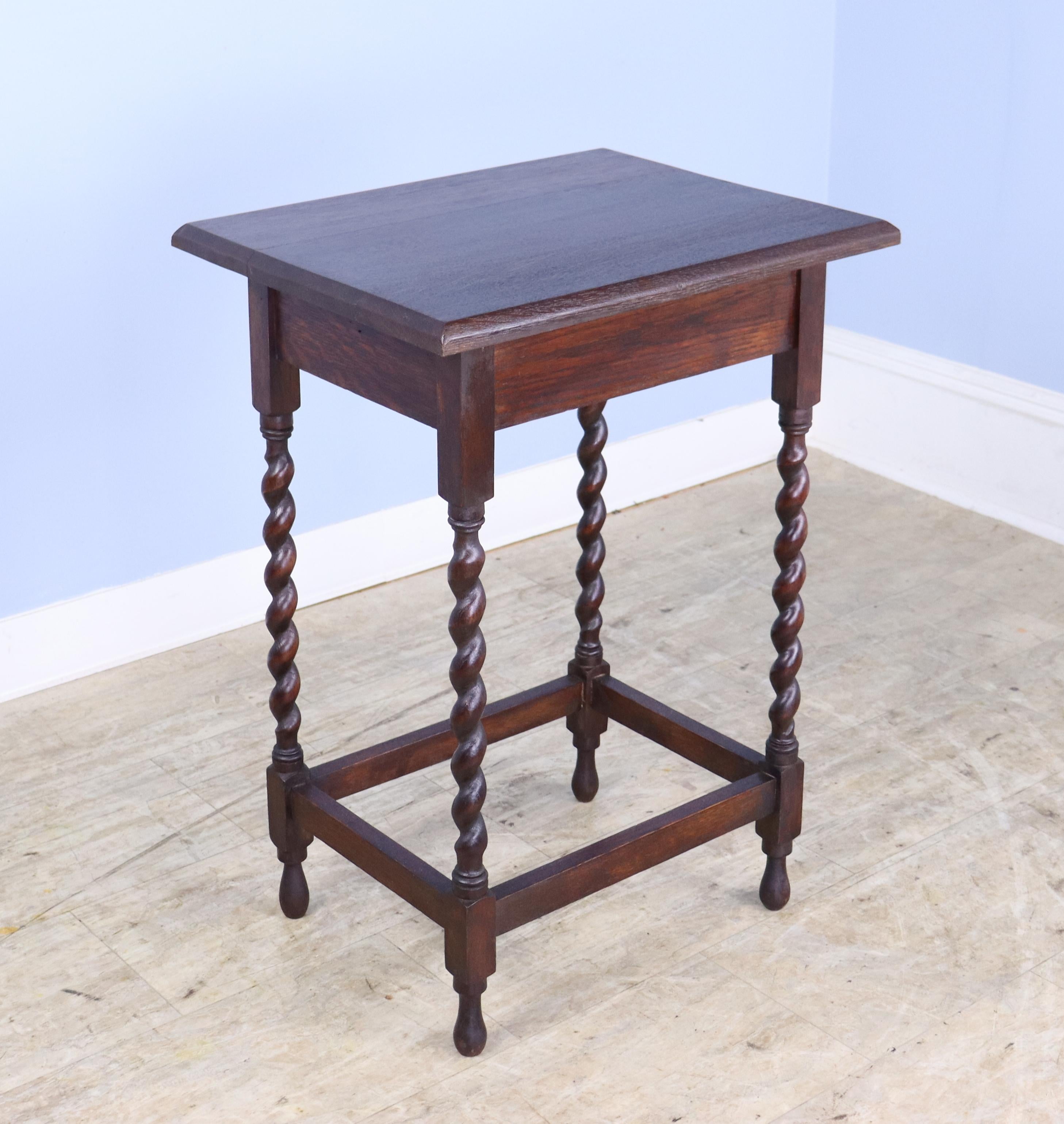 A charming simple occasional table in dark oak with eye-catching barley twist detail. Would also make a nice lamp table, and would pair well on either side of a sofa or guest bed with our other barley twist side table, reference #0623-M82A.