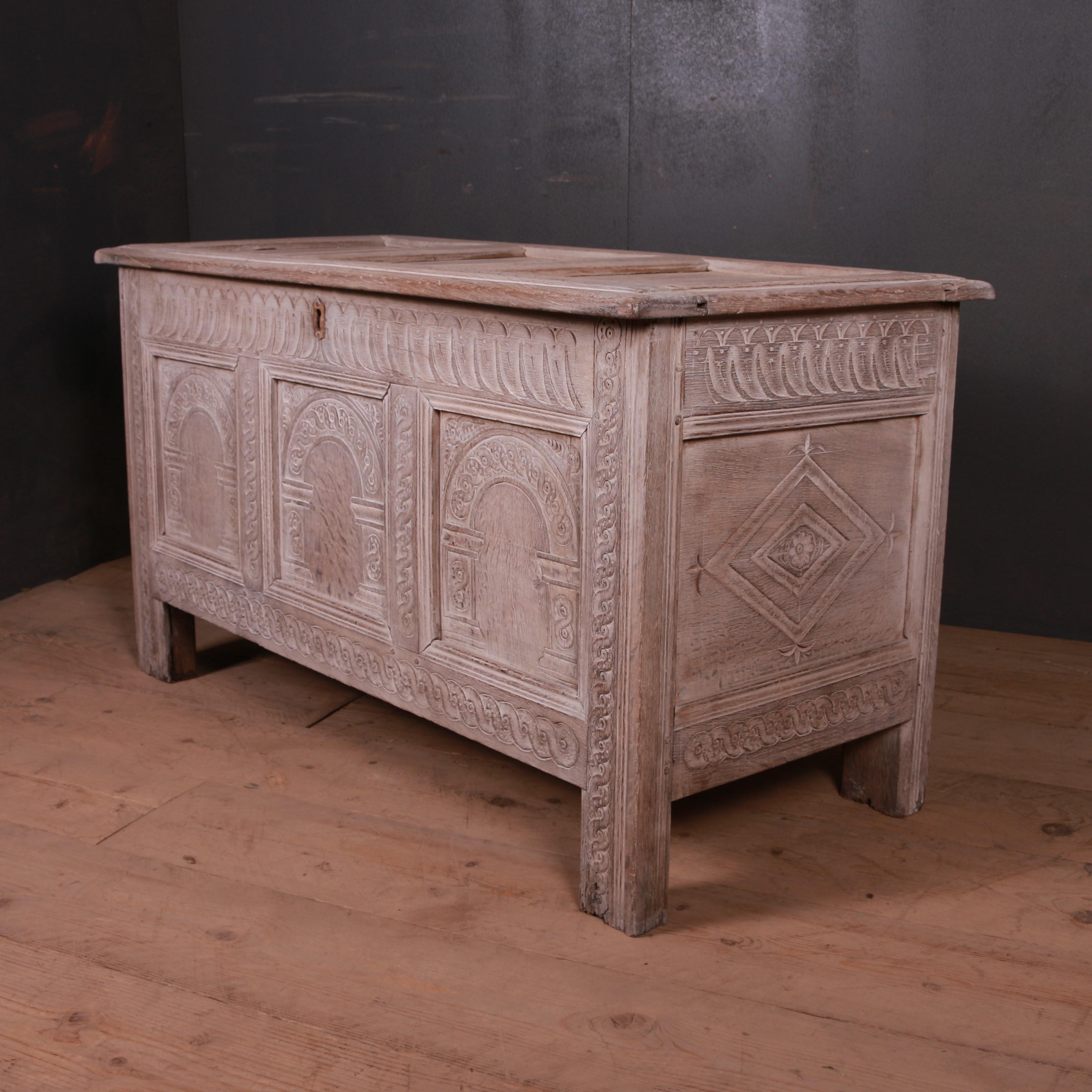 Early 18th century English bleached and carved oak coffer, 1720.

Dimensions:
48 inches (122 cms) wide
22 inches (56 cms) deep
26 inches (66 cms) high.

 