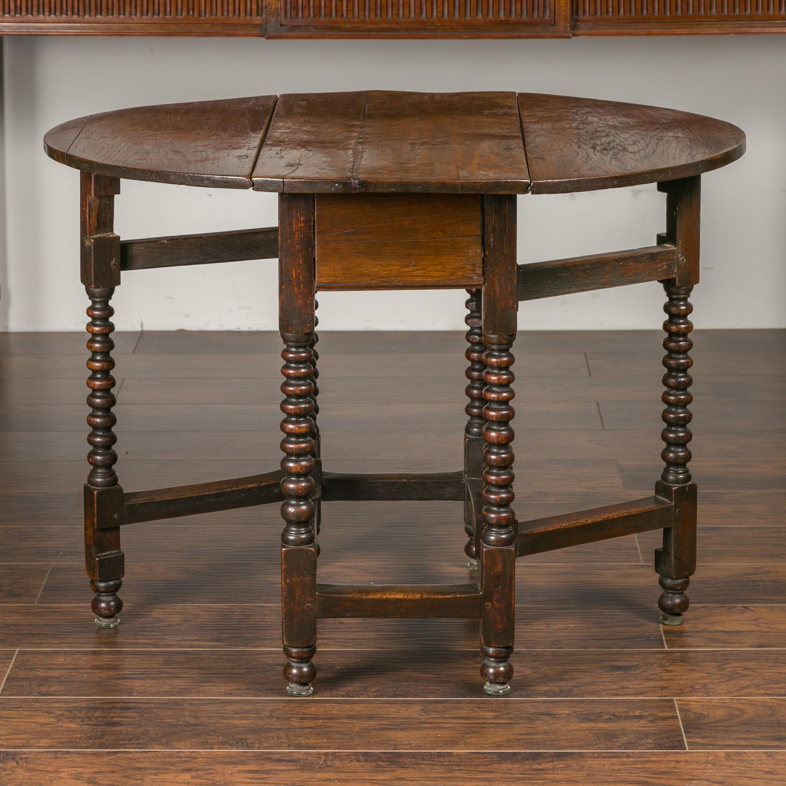 English Oak Bobbin Leg Drop-Leaf Oval Table with Single Drawer and Stretchers 4