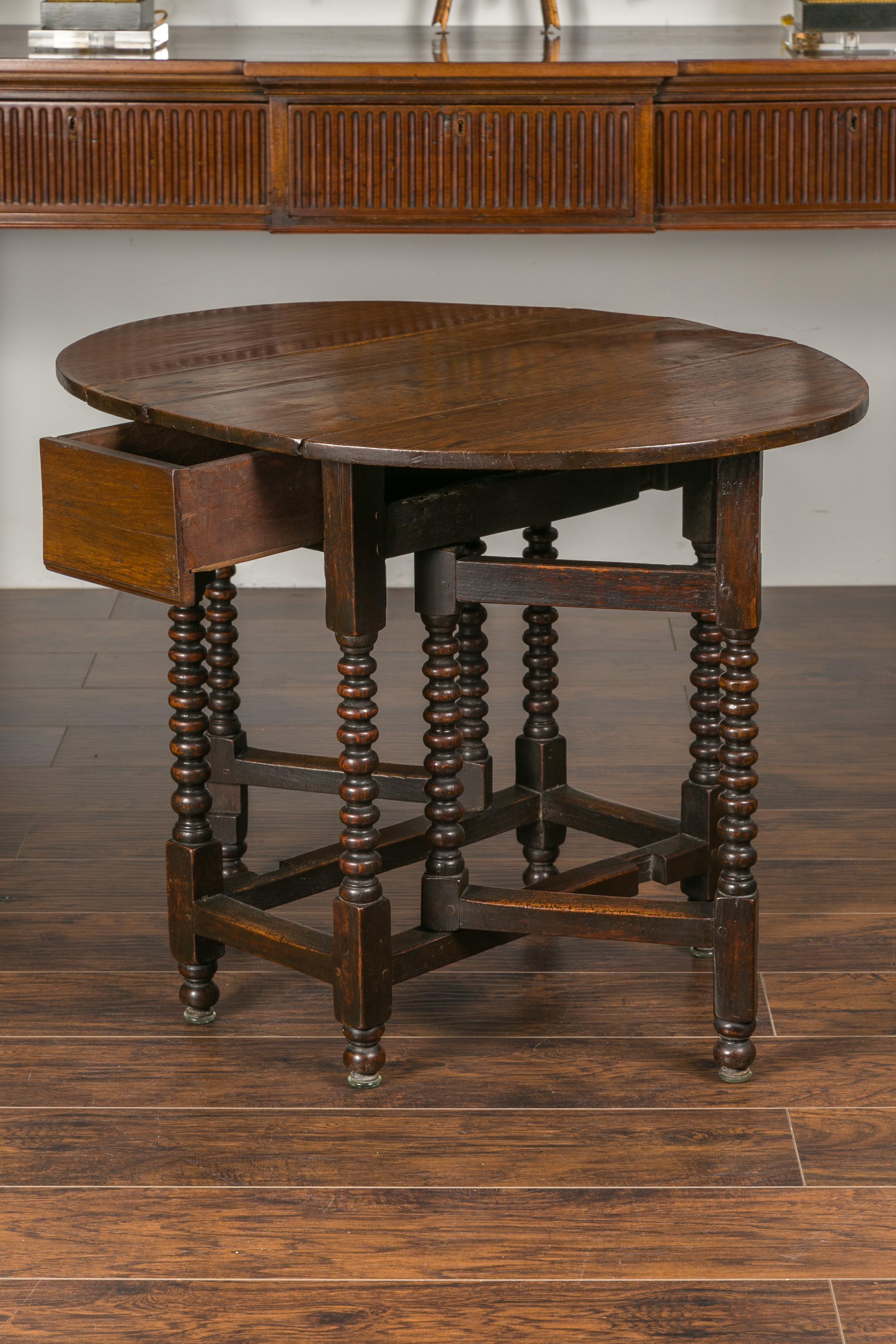 English Oak Bobbin Leg Drop-Leaf Oval Table with Single Drawer and Stretchers 3