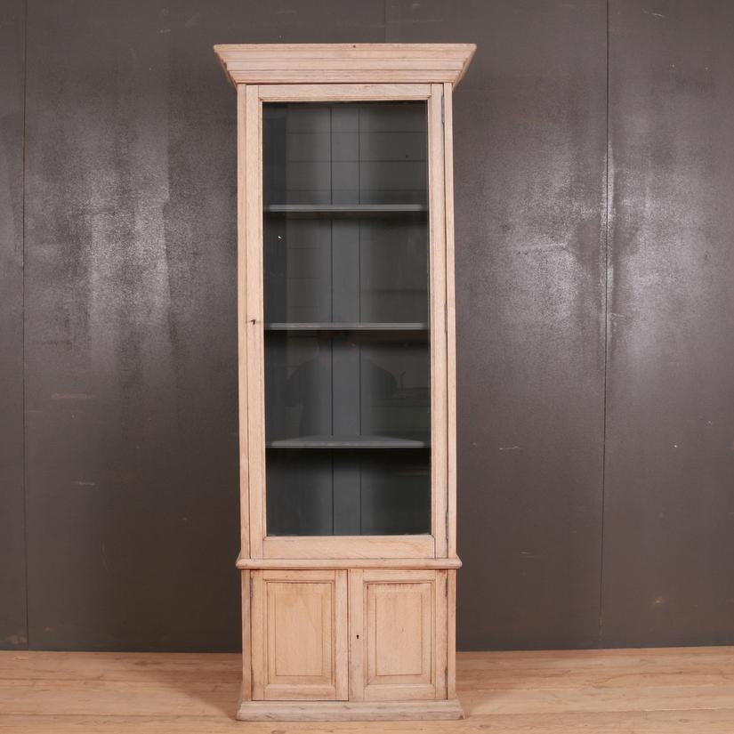 Narrow antique English oak glazed bookcase, 1890.

Internal shelf depth - 9