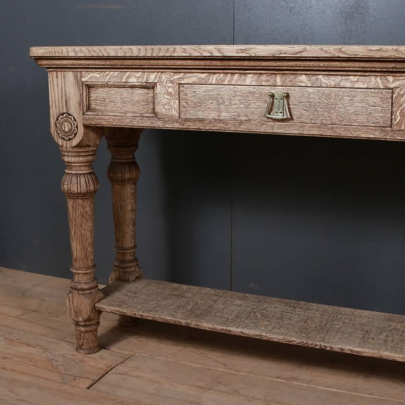 Late 19th century English bleached oak dresser base, 1890

Dimensions
96 inches (244 cms) wide
15.5 inches (39 cms) deep
32.5 inches (83 cms) high.

       