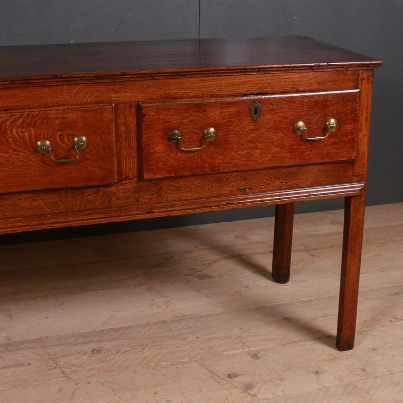 Early 19th century English oak three-drawer dresser base, 1790

Dimensions
72 inches (183 cms) wide
19.5 inches (50 cms) deep
31 inches (79 cms) high.

  