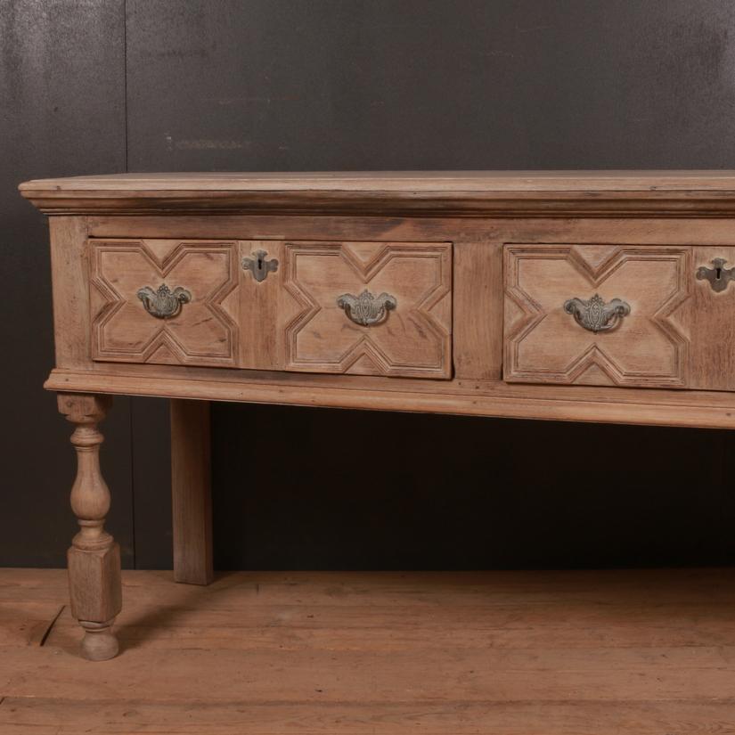 Large 19th century English bleached oak dresser base, 1840

Dimensions:
84.5 inches (215 cms) wide
21 inches (53 cms) deep
33 inches (84 cms) high.

  