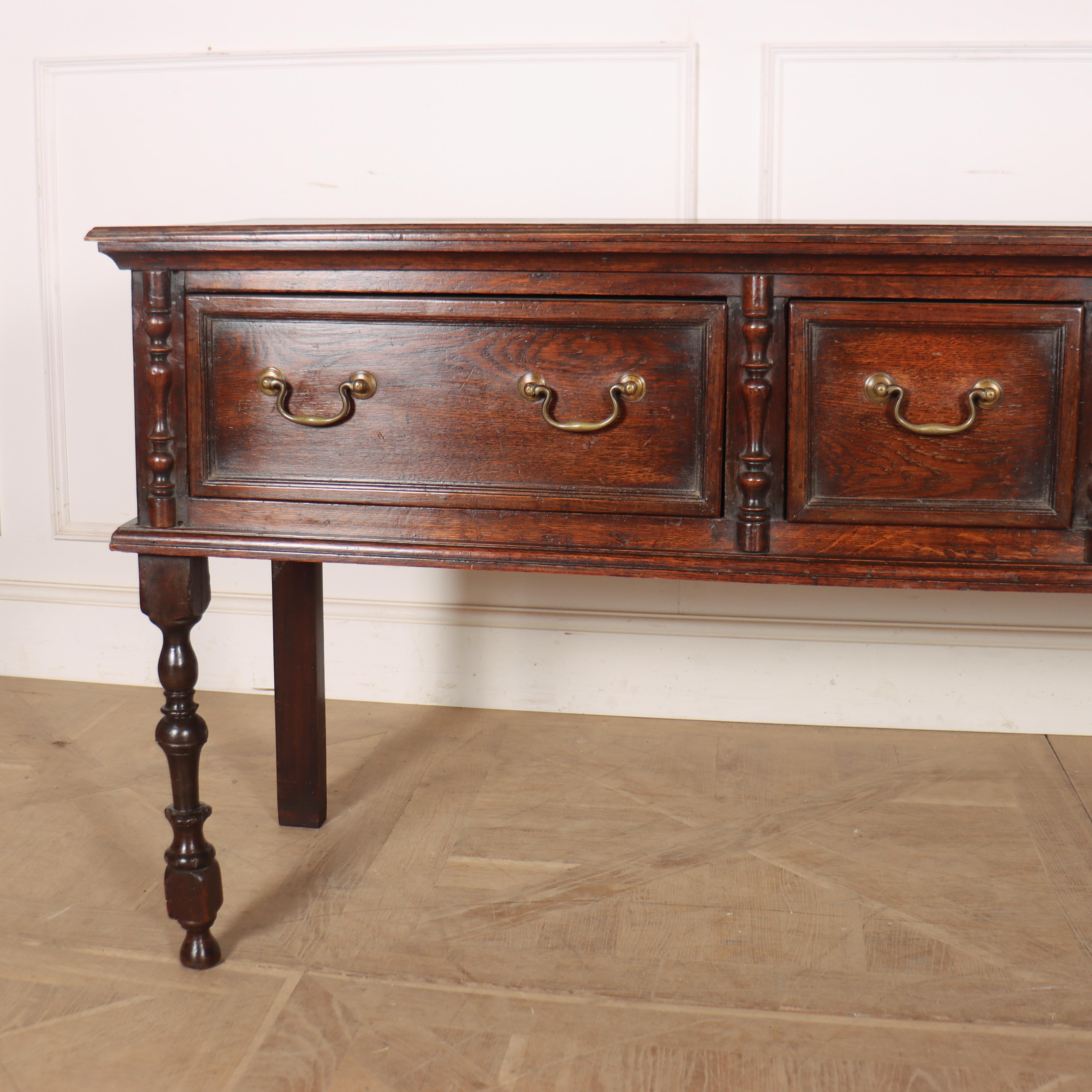 Early 19th century English three drawer oak dresser base with turned legs. Nice colour and a great size. 1820.

Code: 8759

Dimensions:
W: 63