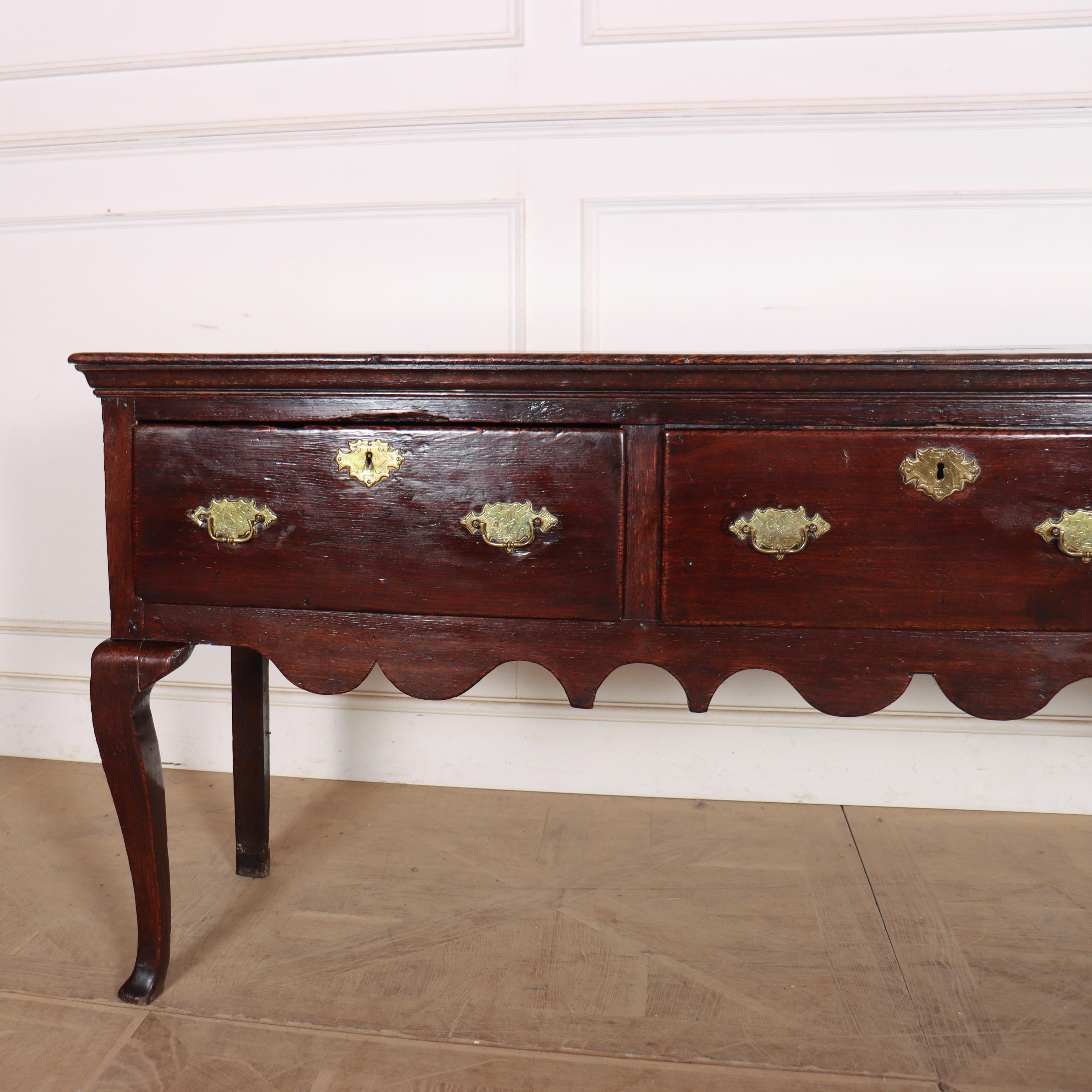Wonderful 18th century English oak dresser base with original brass handles and very good colour. 1760. 


Code: 8954

Dimensions:
W: 74