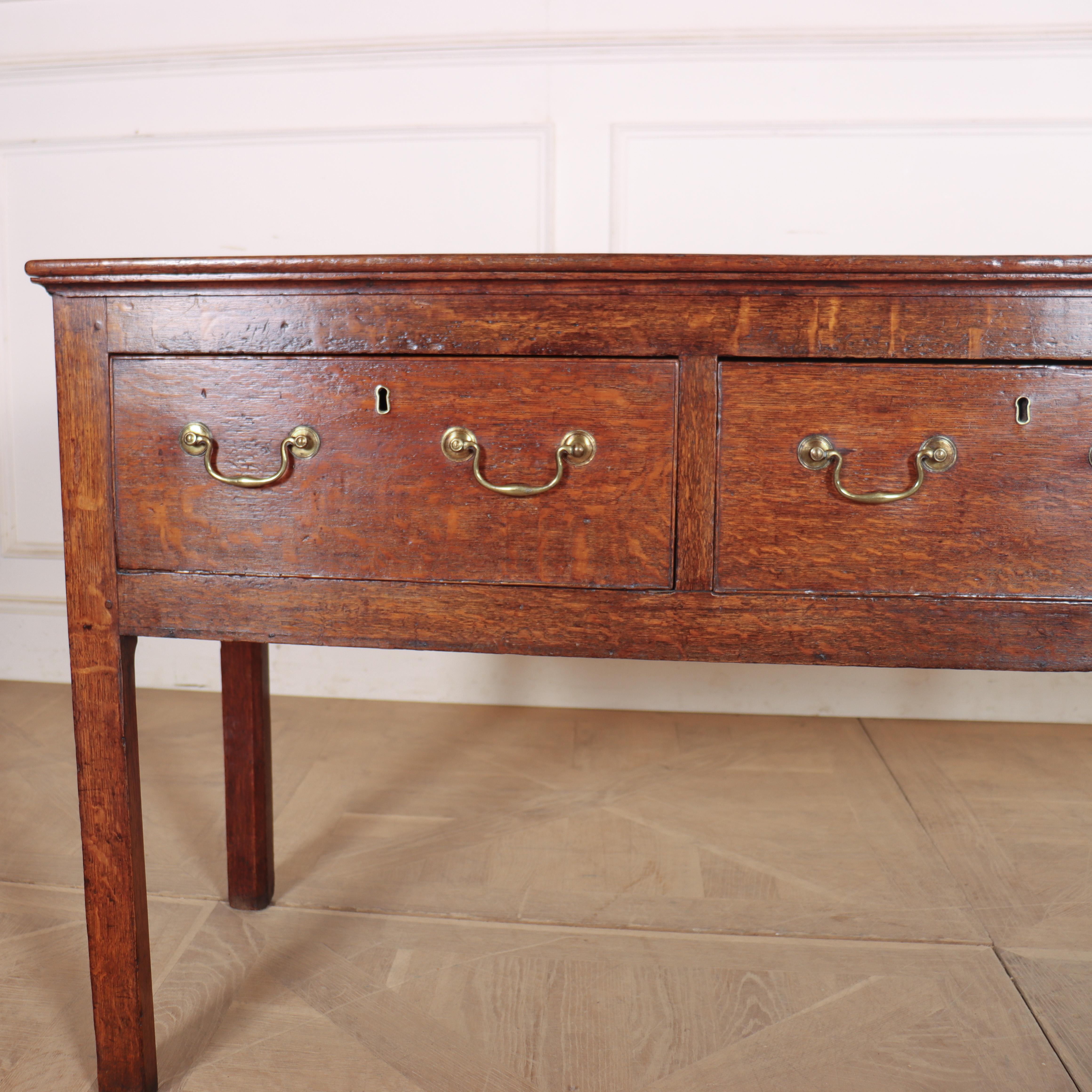 Small 18th century Englsh three drawer oak dresser base with nice colour and original brass handles. 1790. 


Code: 8966

Dimensions:
W: 61