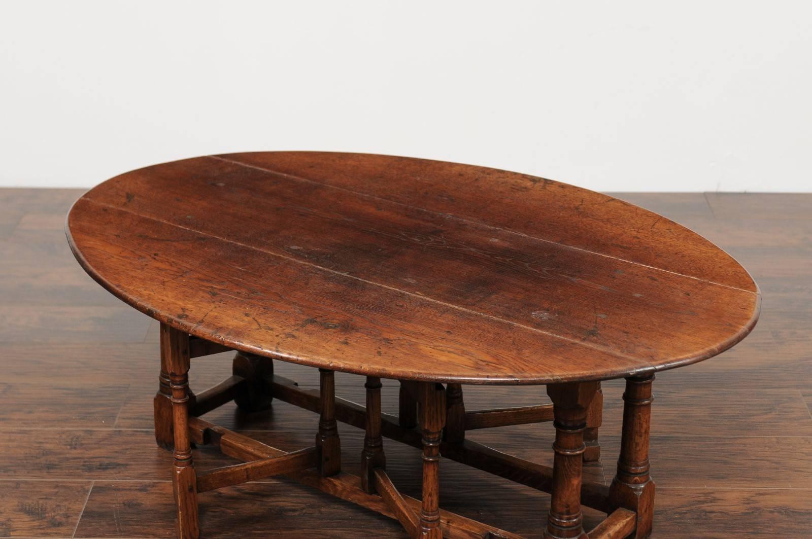 English Oak Drop-Leaf Oval Top Coffee Table with Double Gateleg, circa 1880 In Good Condition In Atlanta, GA