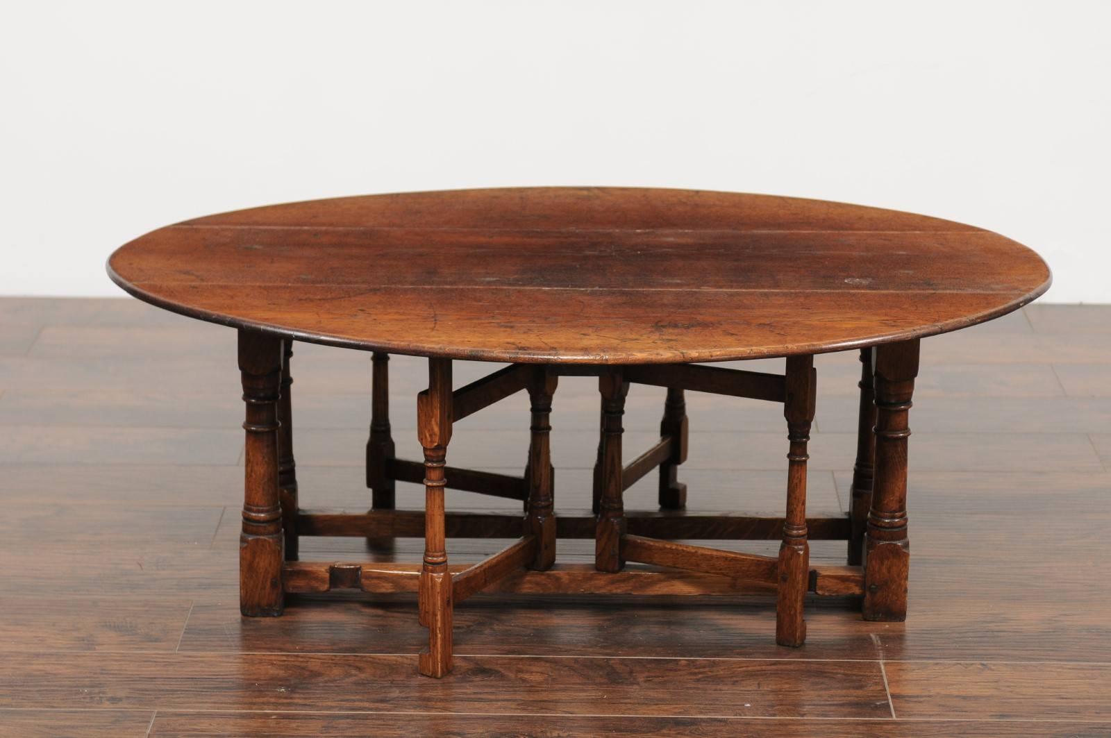 19th Century English Oak Drop-Leaf Oval Top Coffee Table with Double Gateleg, circa 1880
