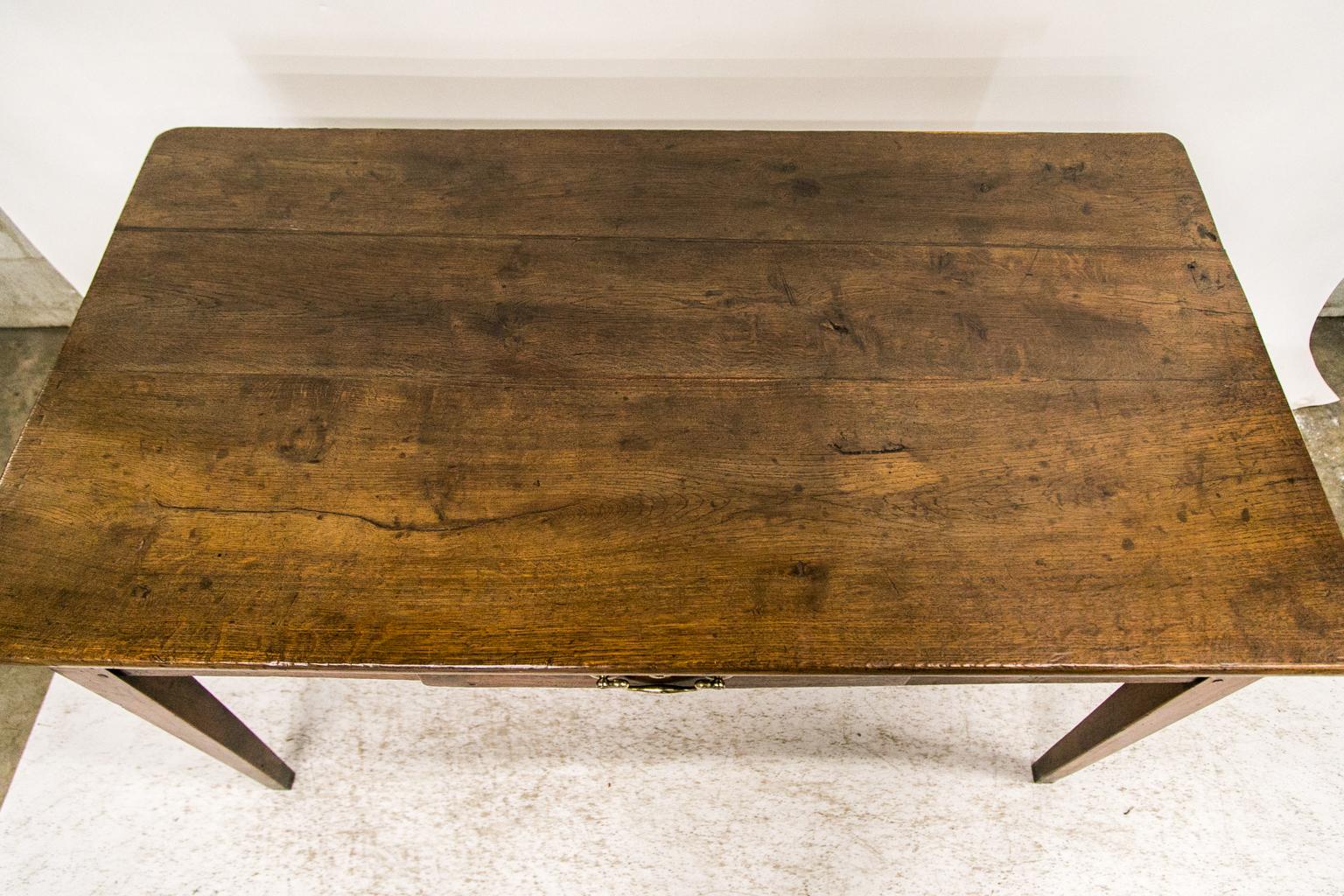 This farm table has exposed double peg construction. The legs are cherry, but all other primary wood is oak. The top has had two shrinkage separations professionally restored.
 