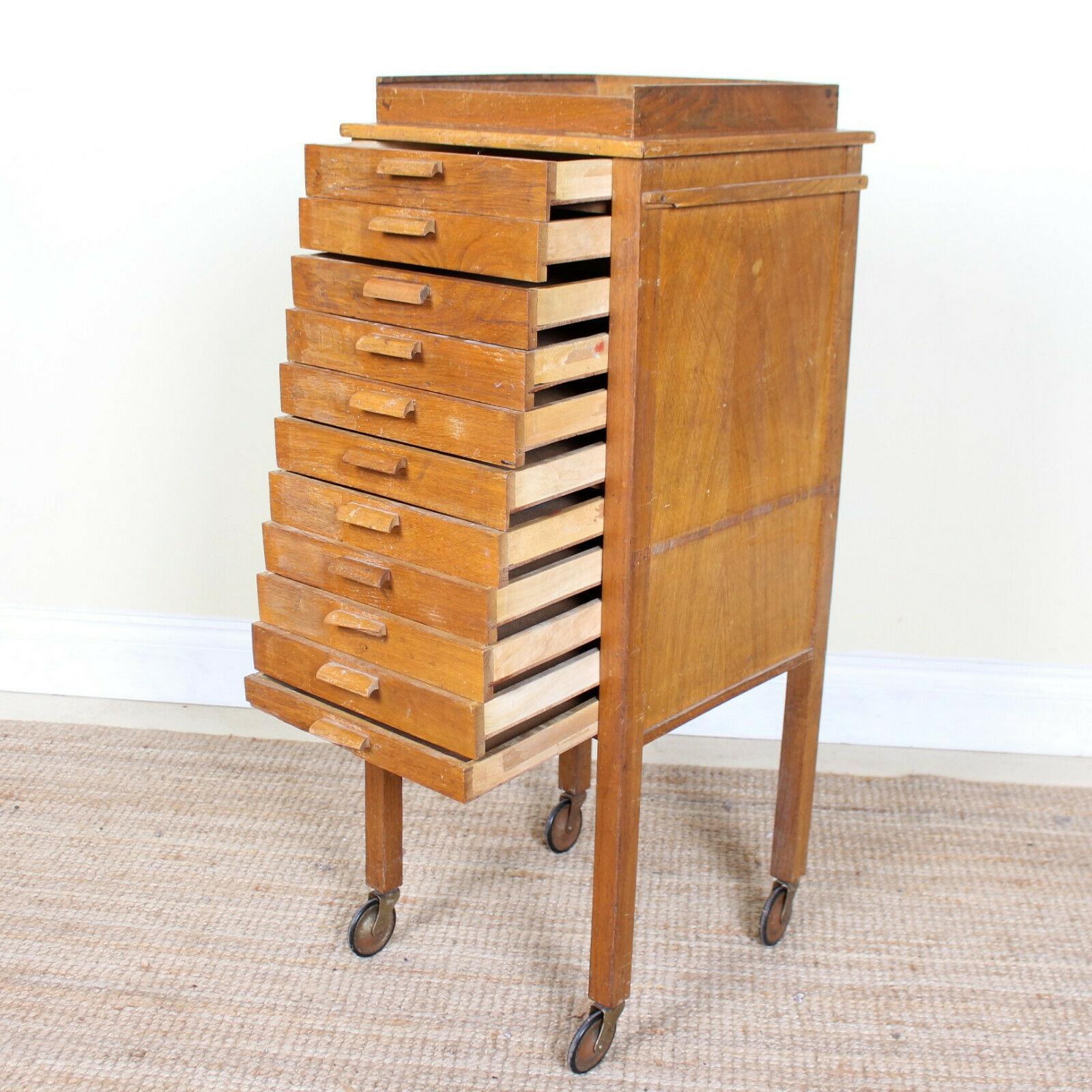 An impressive rare form early 20th century portable oak chest of drawers.
The graduated shallow oak drawers raised on square legs terminating in castors.
Lightly worn and imperfections to drawer fronts handles from age and use, England, circa 1920.