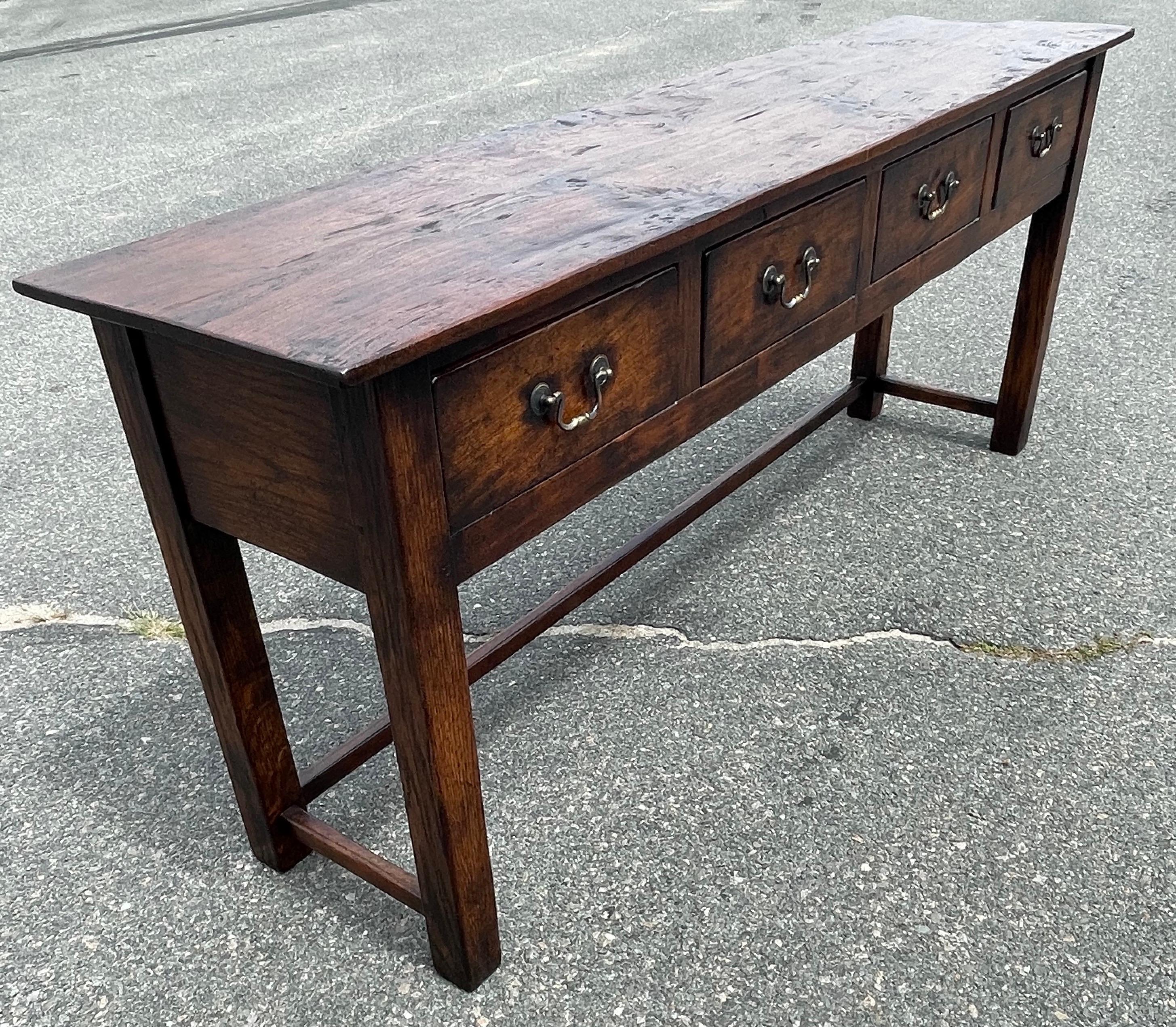 Reproduction four drawer server hand crafted from antique English Oak, with side and back stretcher.