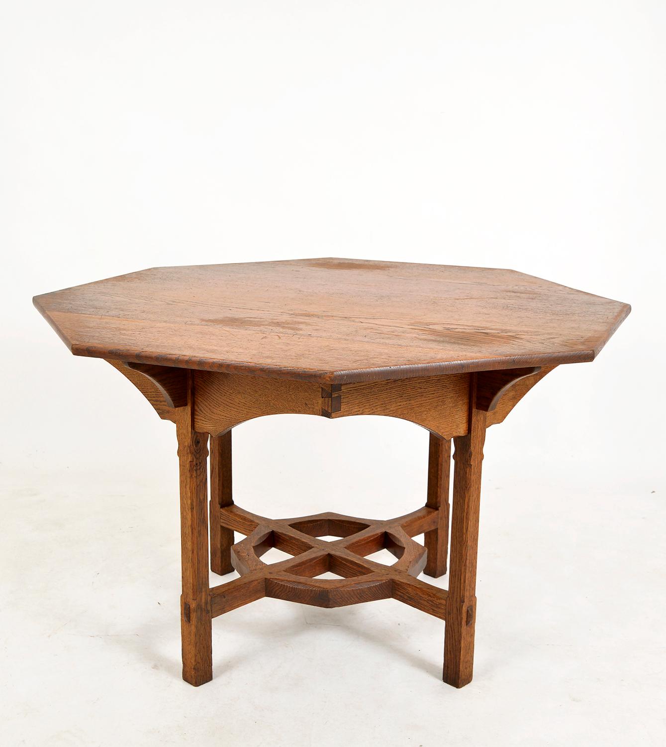 A rare, beautifully hand crafted solid oak octagonal table dating from the early 20th century, purportedly from the workshop of Gordon Russell in Broadway. Constructed entirely from beautifully figured, quarter sawn English oak which now shows a