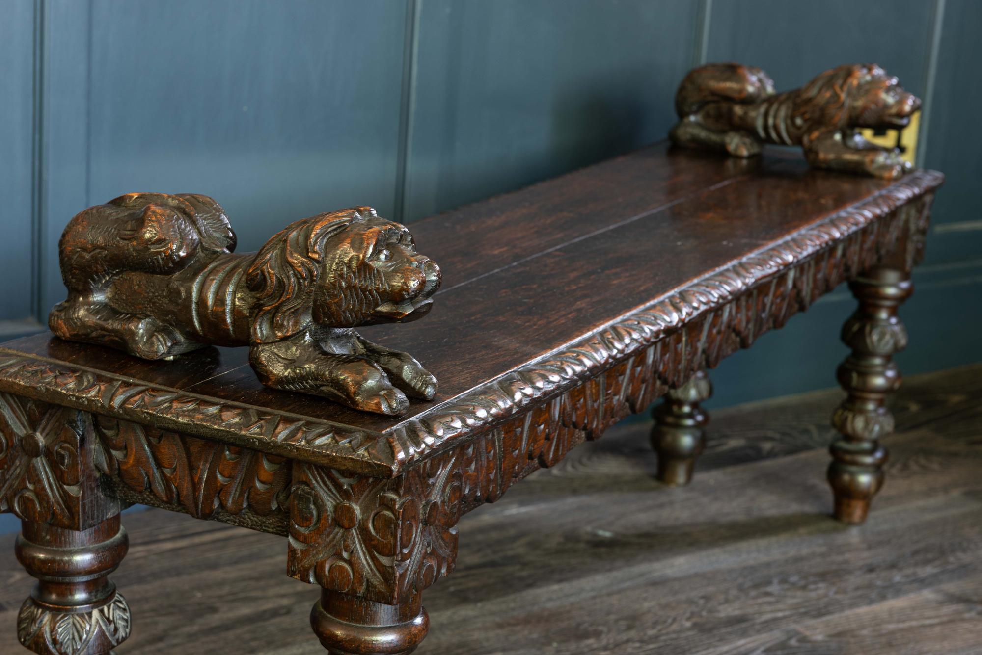 English oak hand carved bench settle with recumbent carved lions, early 19th century
Two plank oak carved beveled edge top with carved decorative apron and legs, square pegged construction. Featuring a pair of carved recumbent lions which are pegged