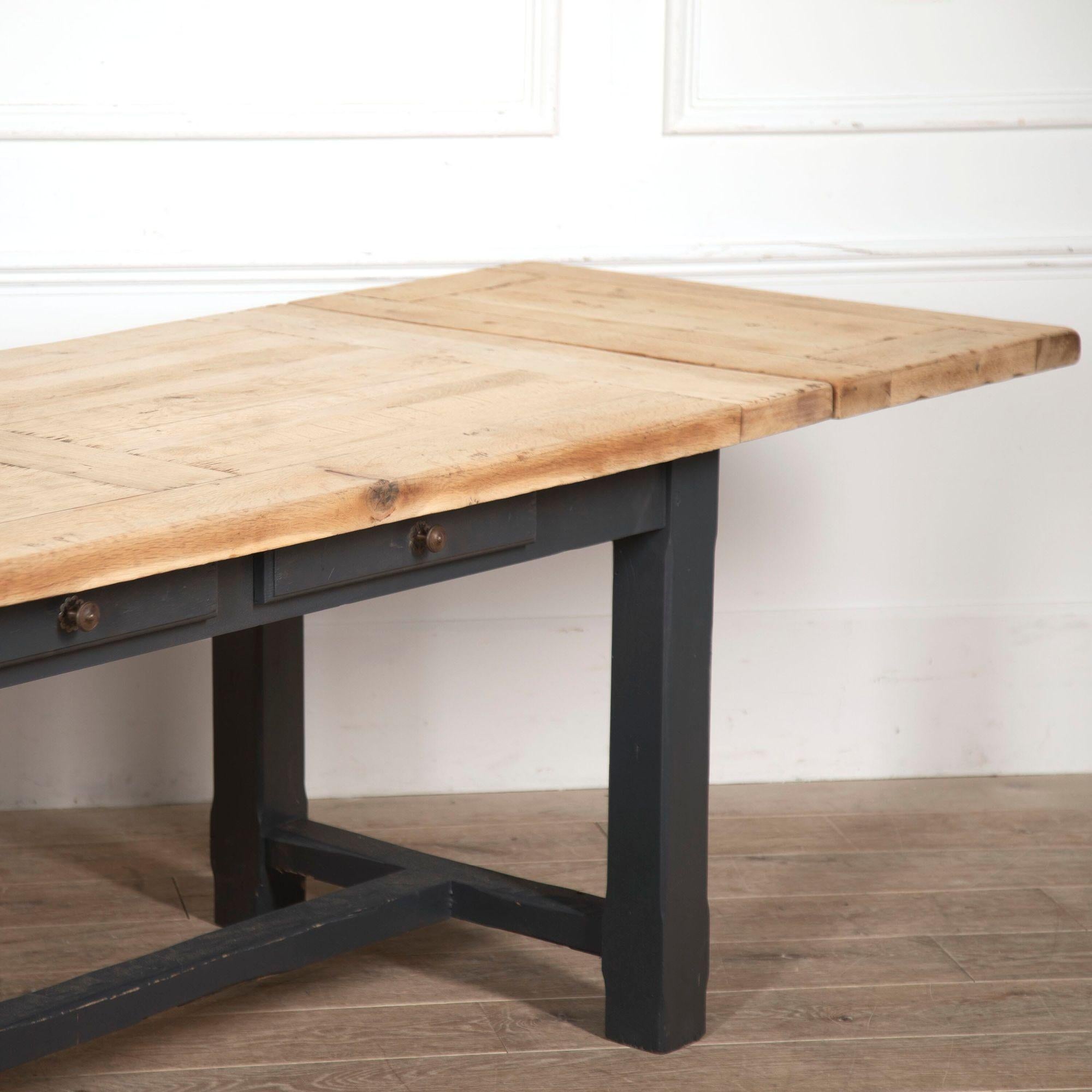Impressive oak refectory table. 
This wonderful table has two drop-leaf extensions that are in great, structural condition. 
The top of the table has been handcrafted with thick pieces of English oak planks that measure to around 4.5cm. This table