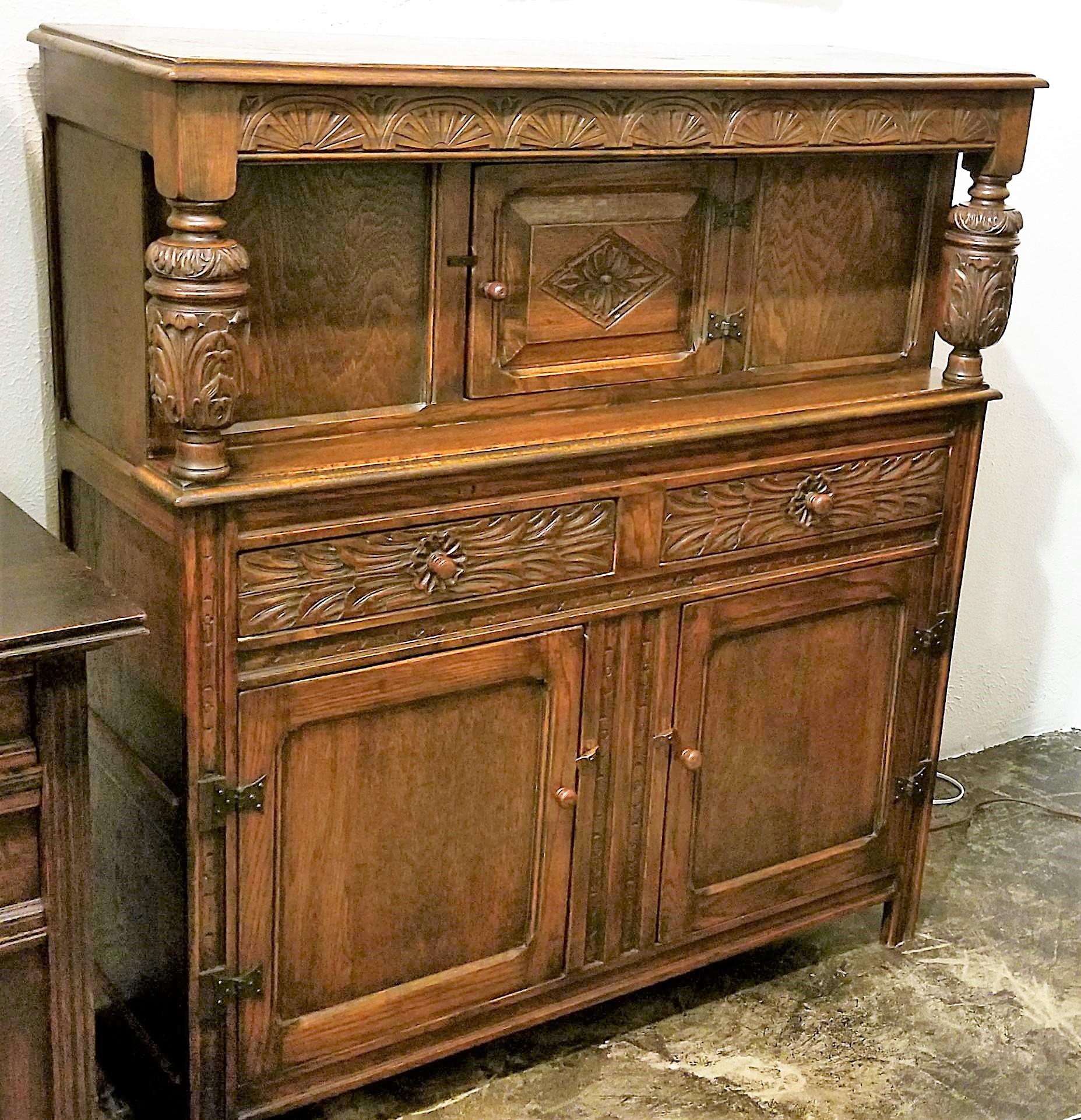 Presenting a really nice example of an early 20th century English oak Renaissance Revival cabinet, all hand carved.

Probably made circa 1900 of English Oak.

Hand carved fan effect under the top shelf.

Hand carved acanthus baluster pillars