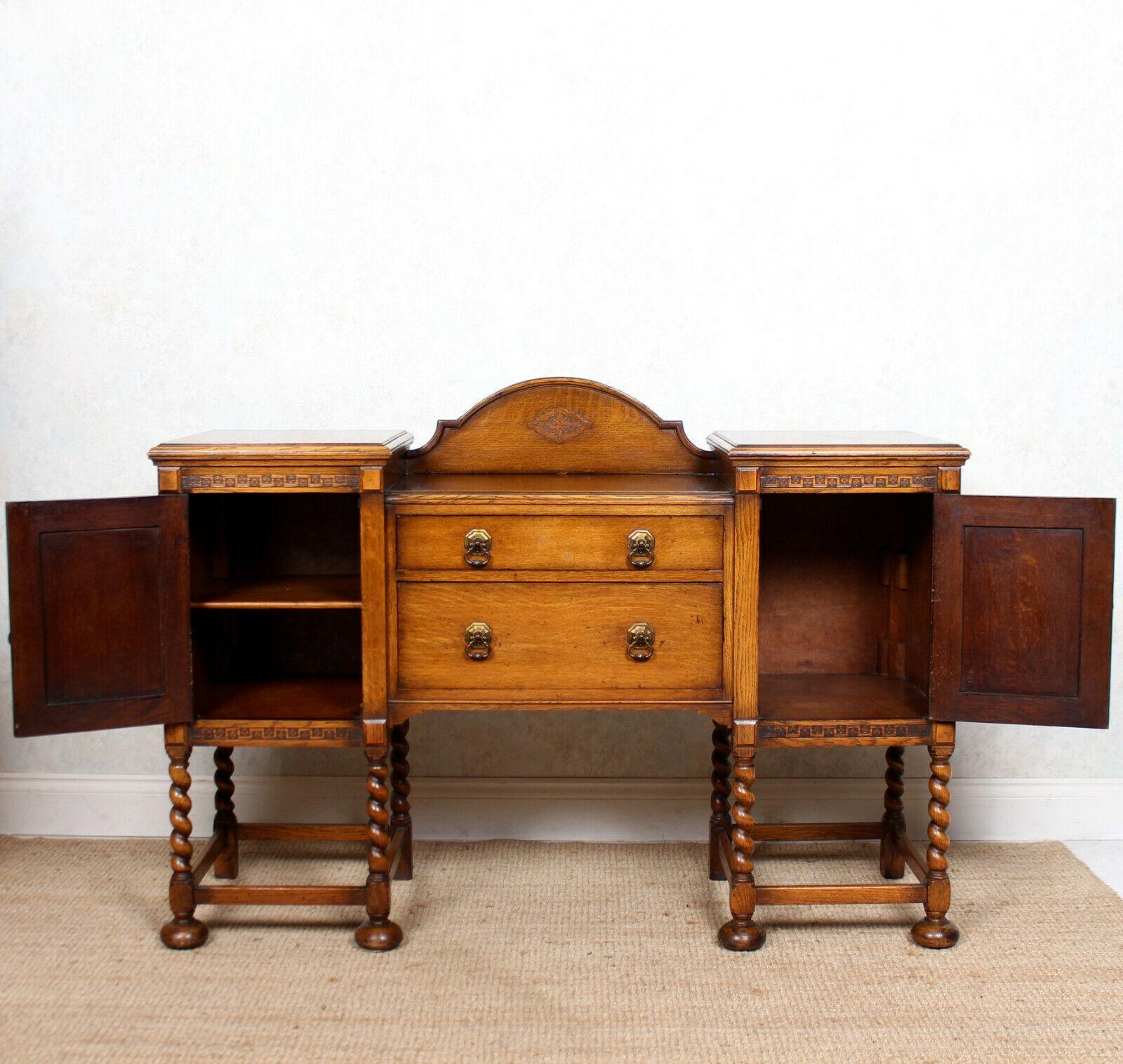 An fine quality early 19th century sideboard in the Arts & Crafts manner.

Constructed from solid oak boasting a rich honey patina and well figured wild grain and boasting impressive carvings throughout with chamfered edges.

A carved demilune